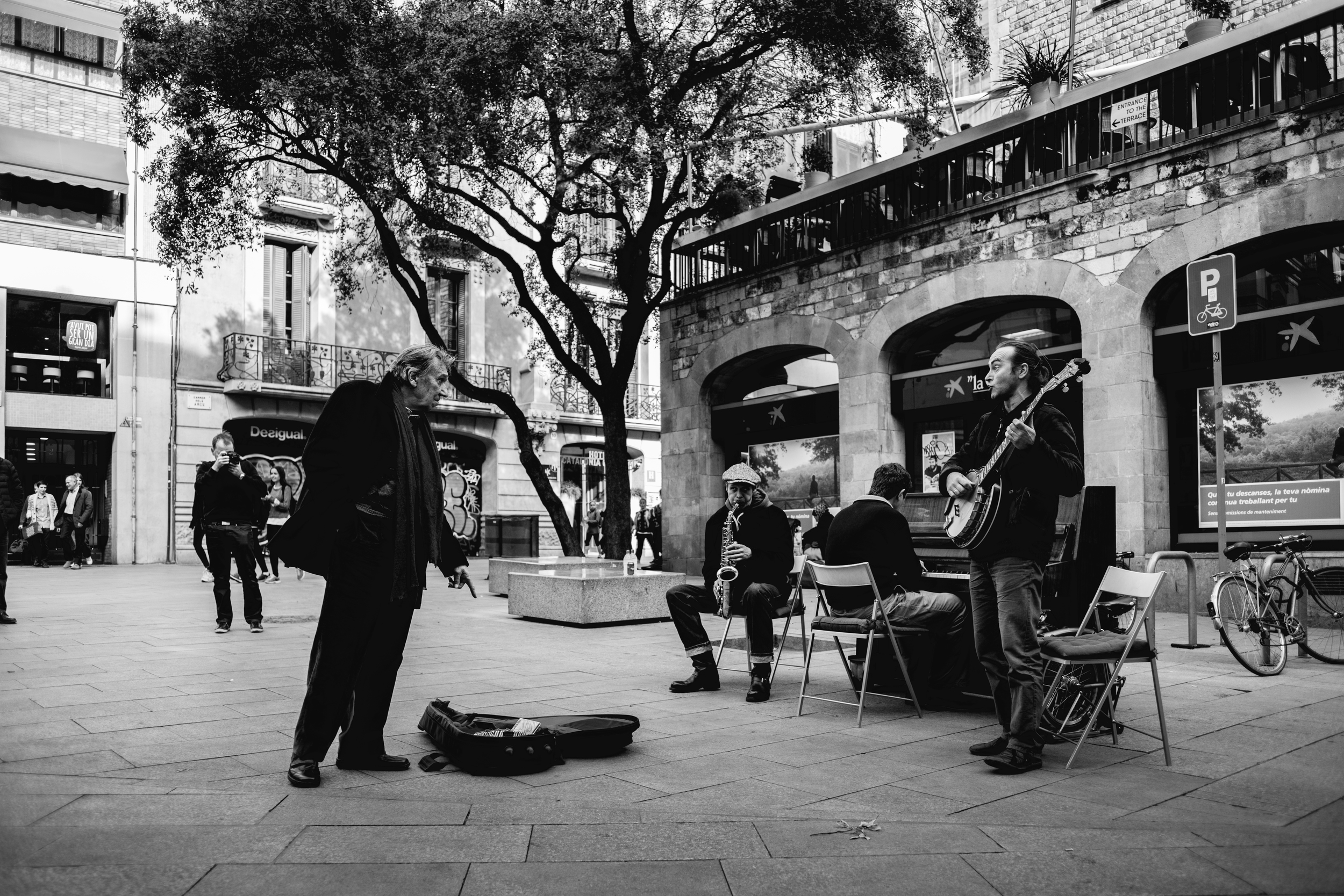 Street musicians and customers, Barcelona, Spain