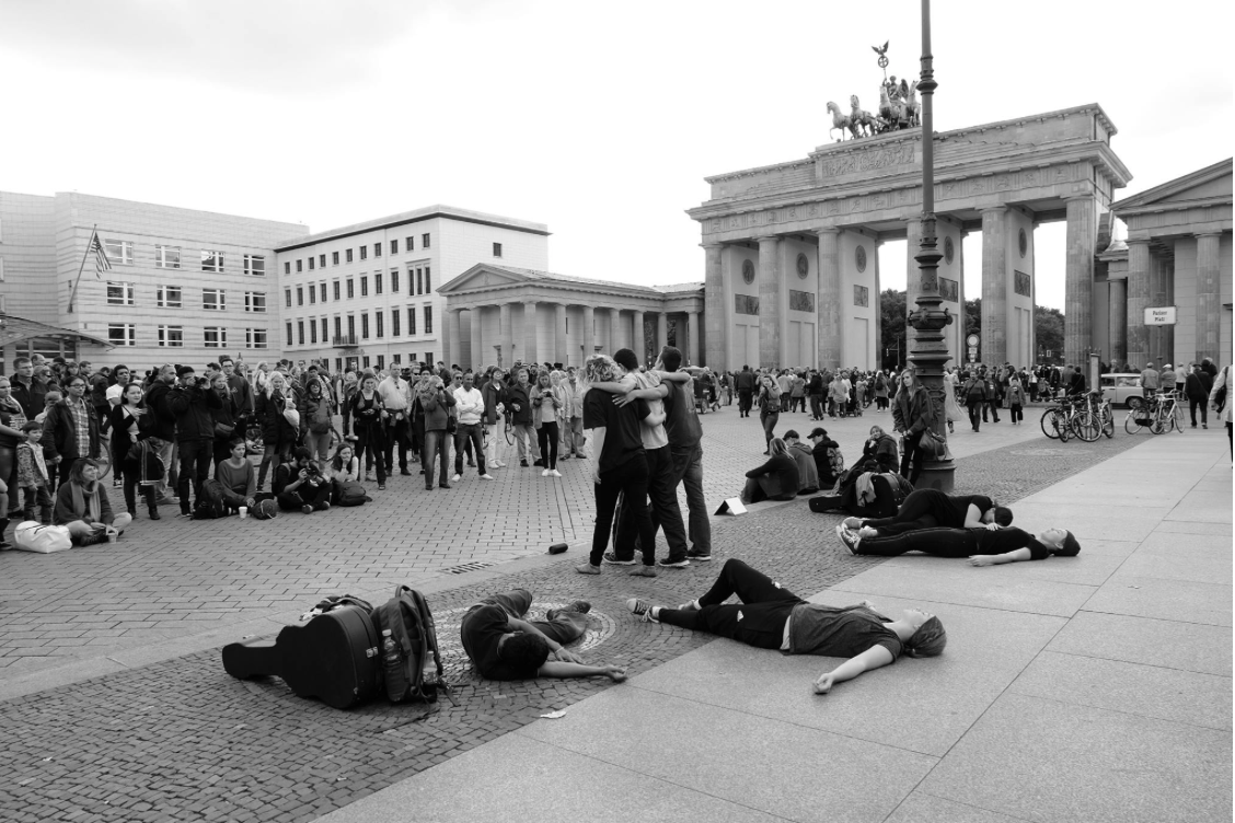 Team performing in front of the Brandenburg Gate, Berlin