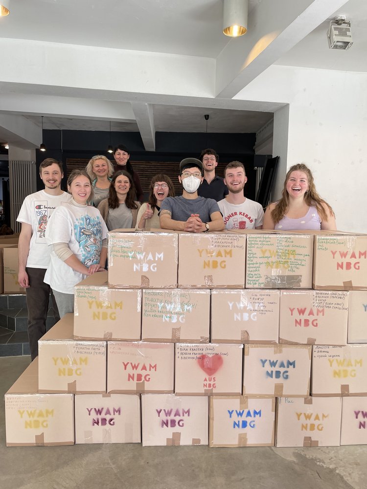 YWAMers and Ukrainians packing boxes of food to send to Ukraine