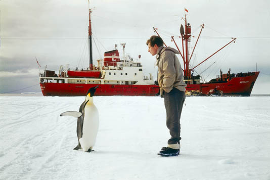 Physicist, Jeremy T. Bailey, consults a local for directions to the South Pole.