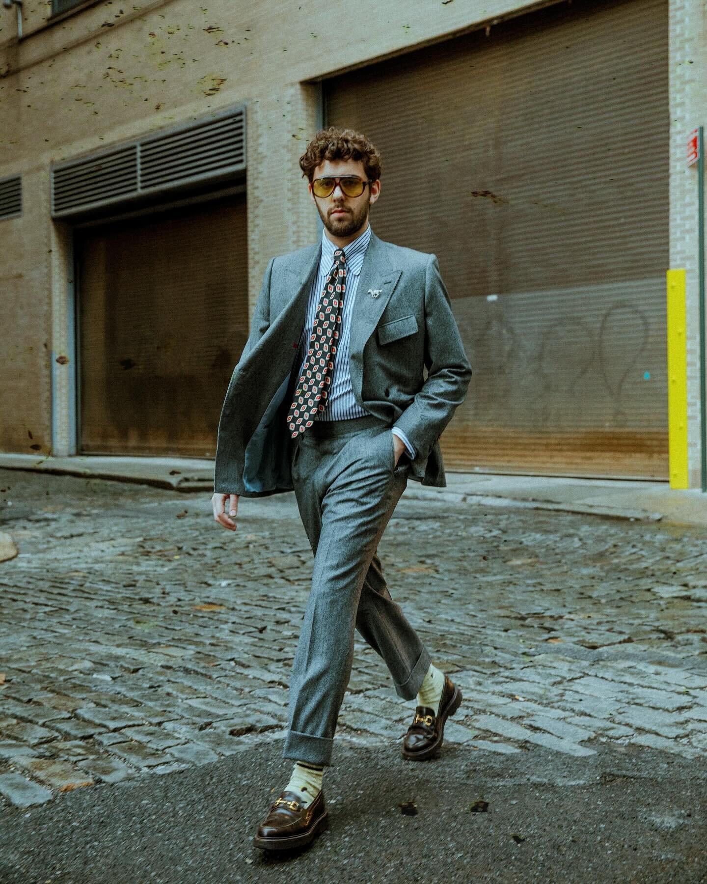 Simon Goldman (@simon__gold) came by the shop recently and documented the experience in a Reel you can watch over at his account. Here, he&rsquo;s photographed in TriBeCa in our S.A.D. aviators, brown snaffle bit lug loafers, and grey dogstooth flann