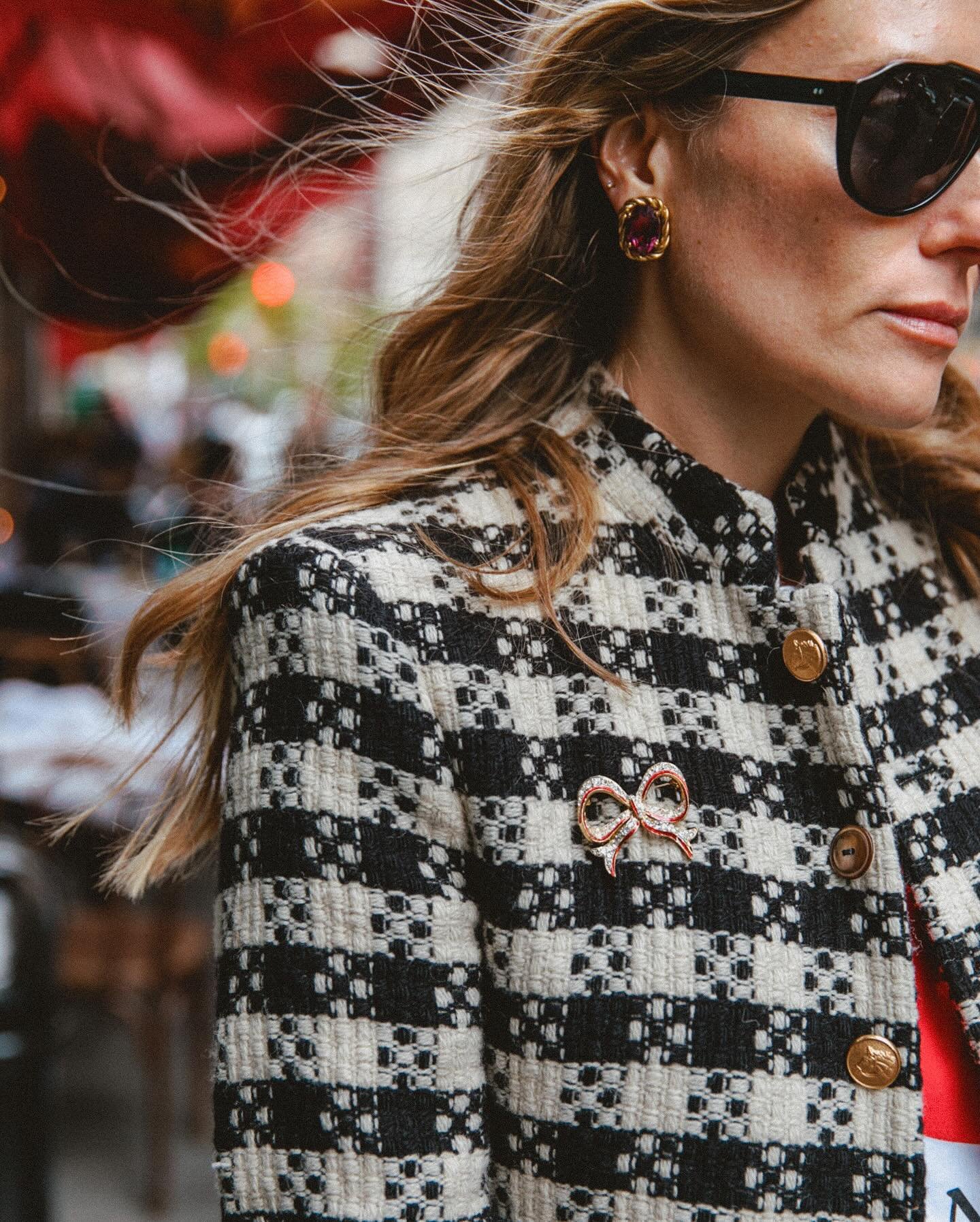 Liz Toney (@lizgreytoney) in our Wool Boucle Jacket (available made-to-order), accessorized with a vintage bow brooch, vintage Celine earrings, and our aviator sunglass.
