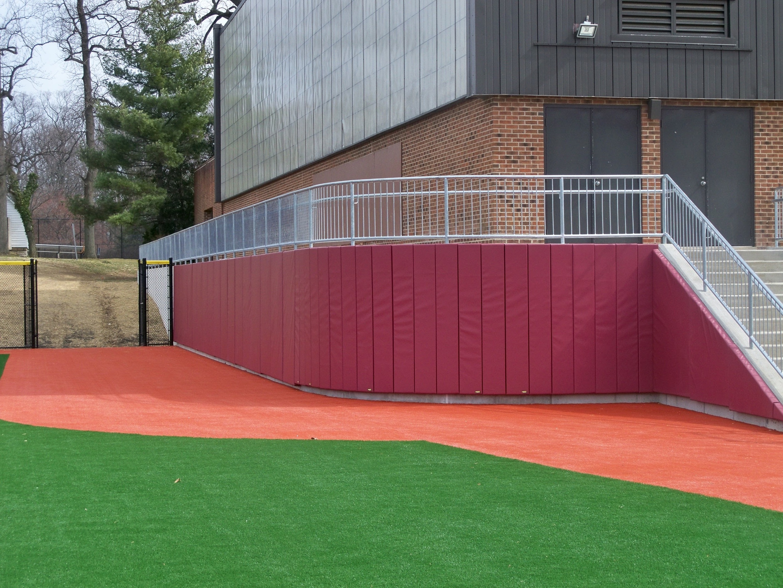 SJU 005 03.09.12 Curved Wall Padding at BB Outfield.jpg