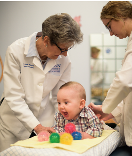 Muriel Périllat, DC, MS works with children