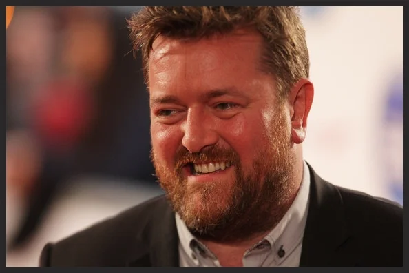 Guy Garvey, the lead singer of Manchester band Elbow , had previously featured on the Heligoland track, Flat Of The Blade .