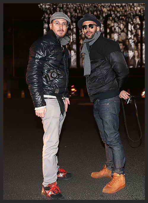 Darren Aronofsky and JR outside their public outdoor art exhibit "The Standing March" in Paris.