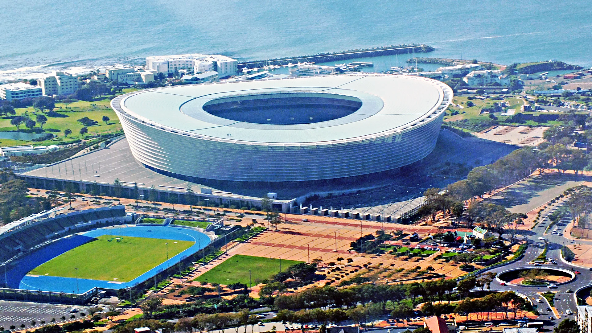 " Cape Town Stadium Aerial View " by M aryland Pride licensed under CC BY 3.0.