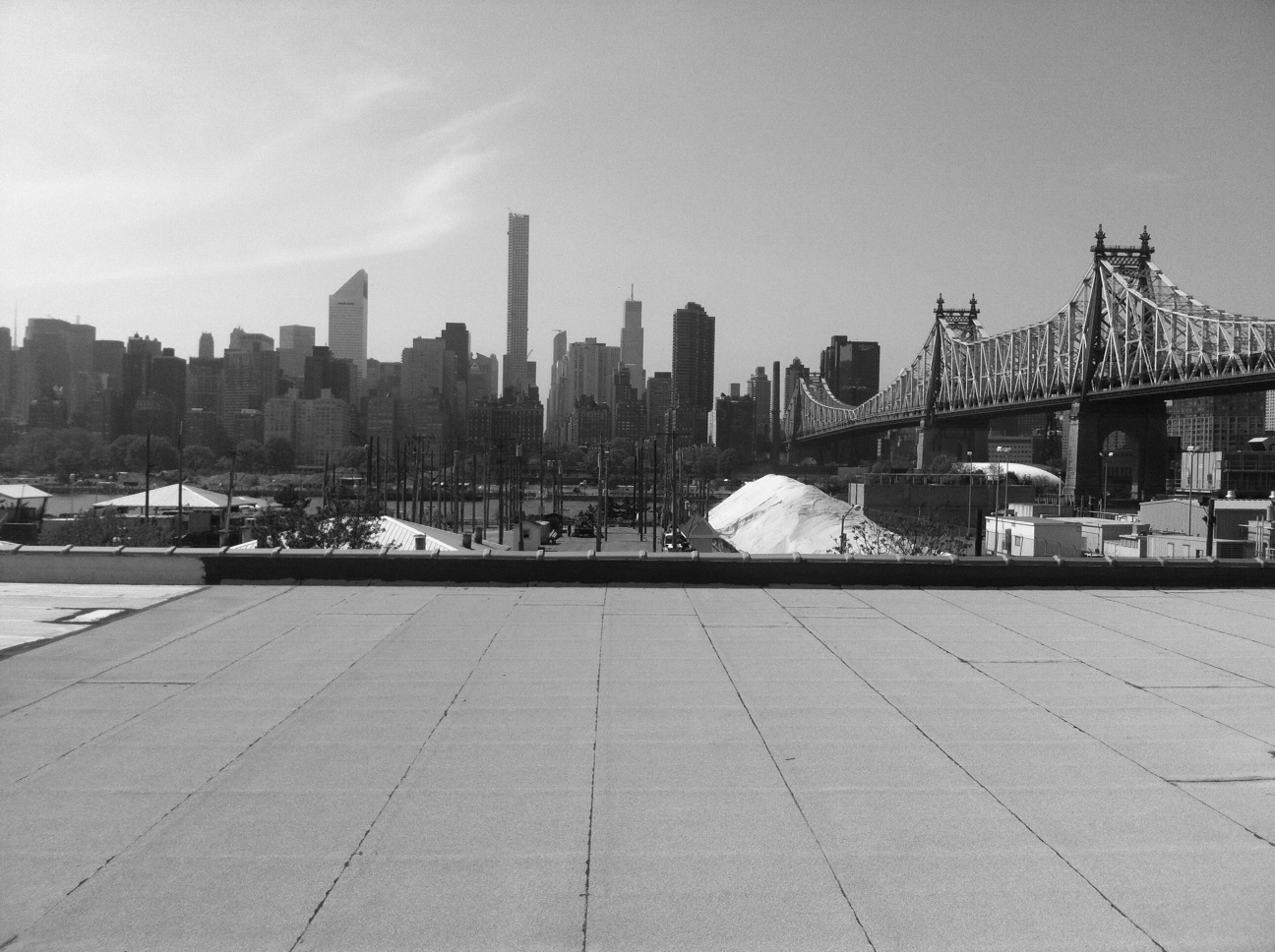 Panoramic view of the Manhattan skyline and Queensboro Bridge. One block away from the East River