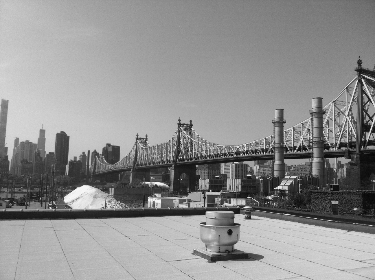 Panoramic view of the Manhattan skyline and Queensboro Bridge. One block away from the East River