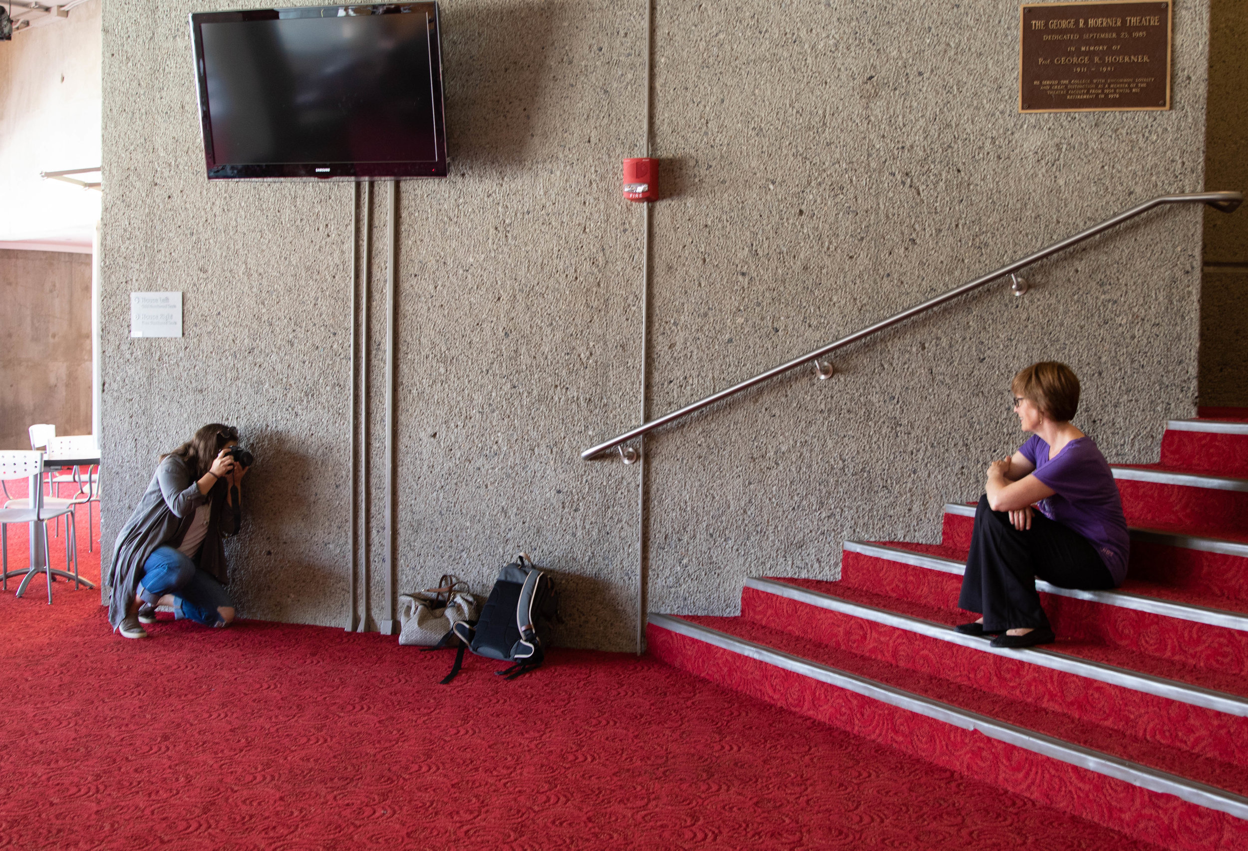 Kristen Harrison photographs theater professor Kathleen Mulligan for The Ithacan. (Zach Cercone / Stillwater Magazine)