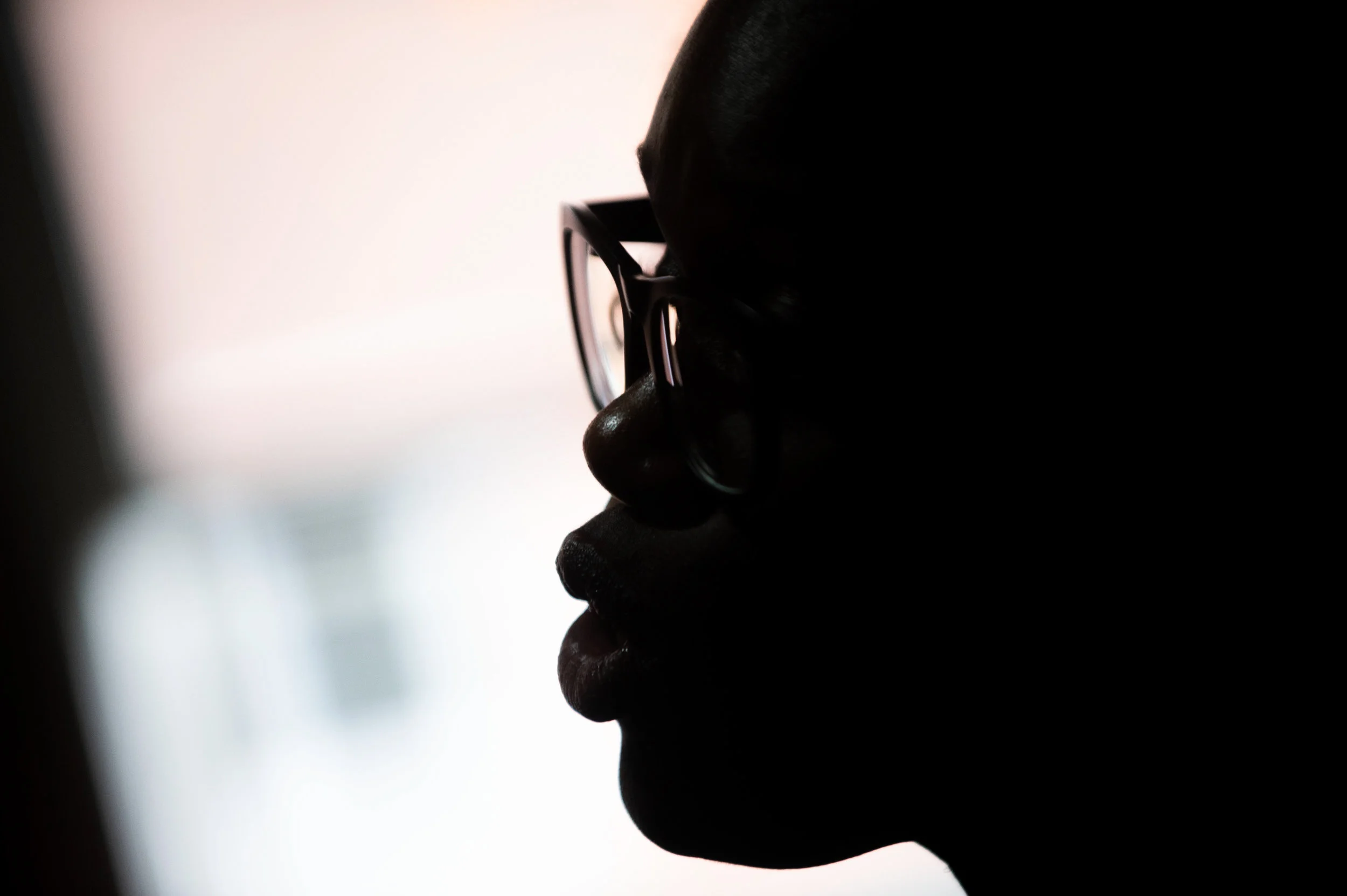 “This is Shalon Buskirk, she was one of the women who had lost her son to gun violence. Here she's speaking to the reporter; she's in the interview. It was basically at her dining room table, so I was looking for different ways to photograph her. I …
