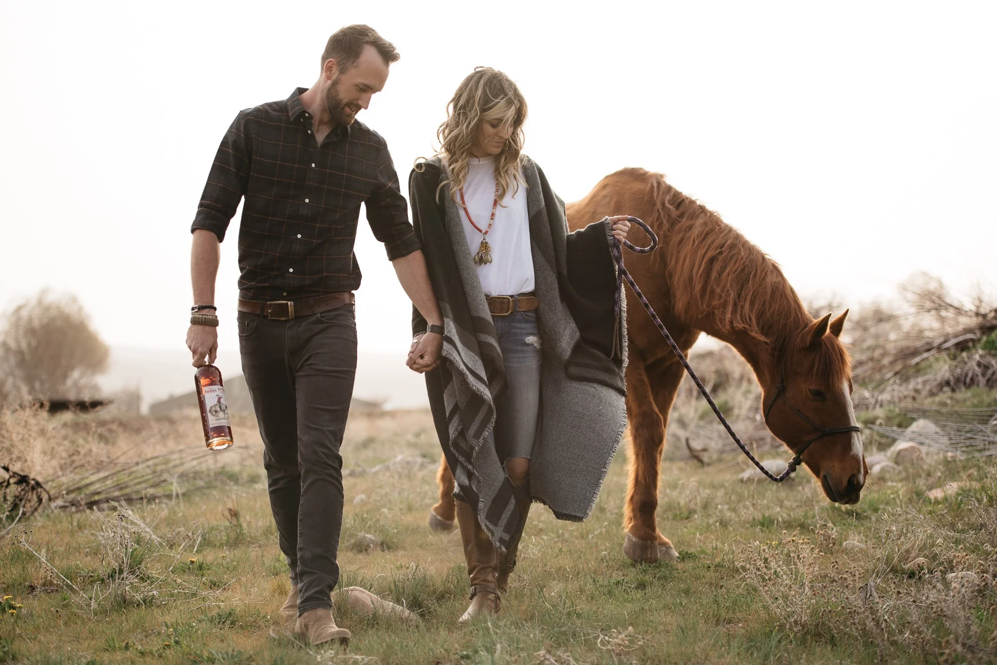 Portrait of couple with horse in Park City, Utah during the summer. 