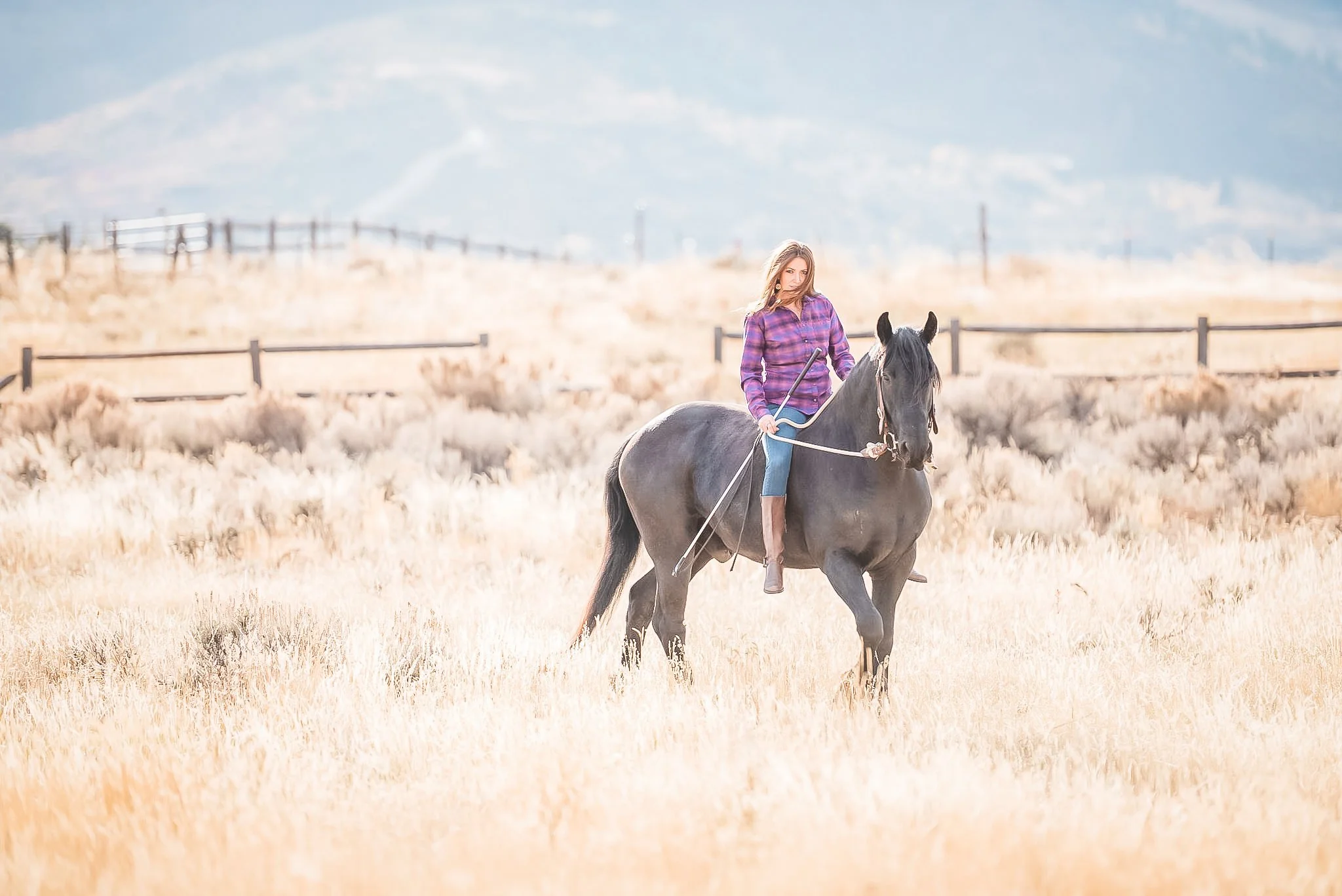 Portrait of woman riding her horse in Park City, Utah during the summer. 