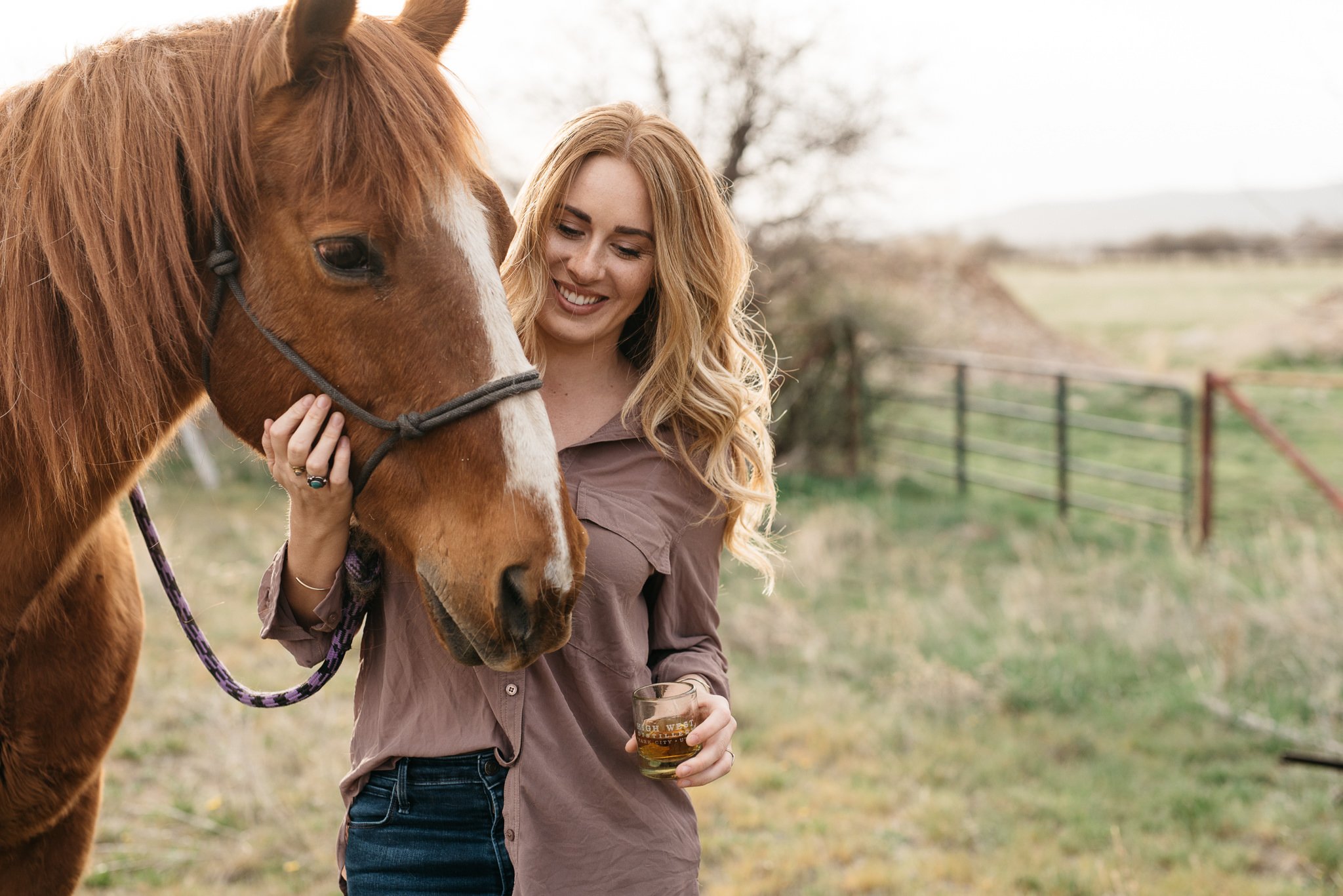 Portrait of woman with horse in Park City, Utah during the summer. 