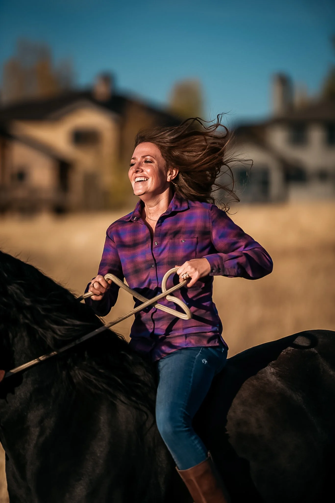 Portrait of woman riding her horse in Park City, Utah during the summer. 