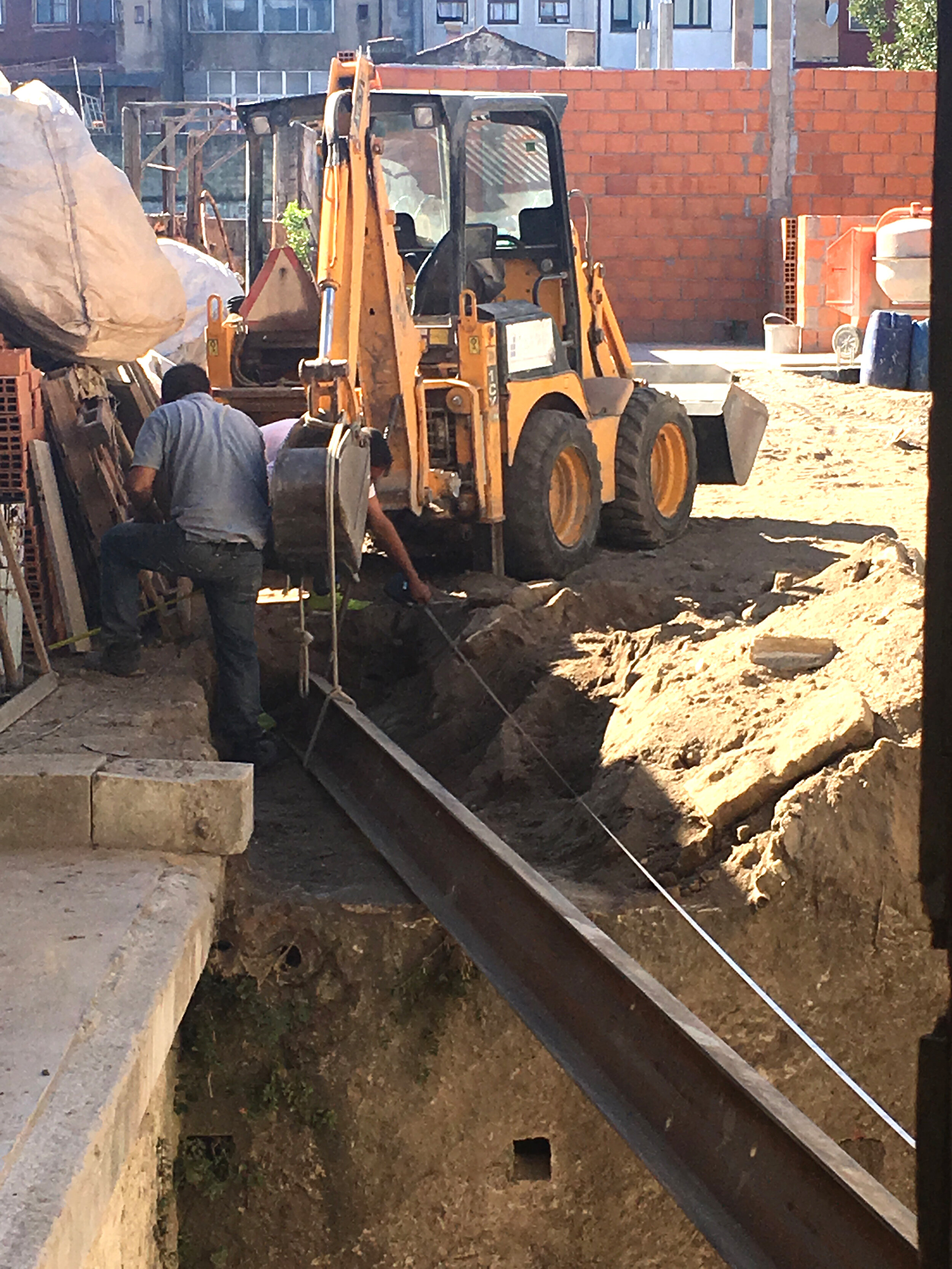 Pulling the iron beam into place for kitchen in apartment C