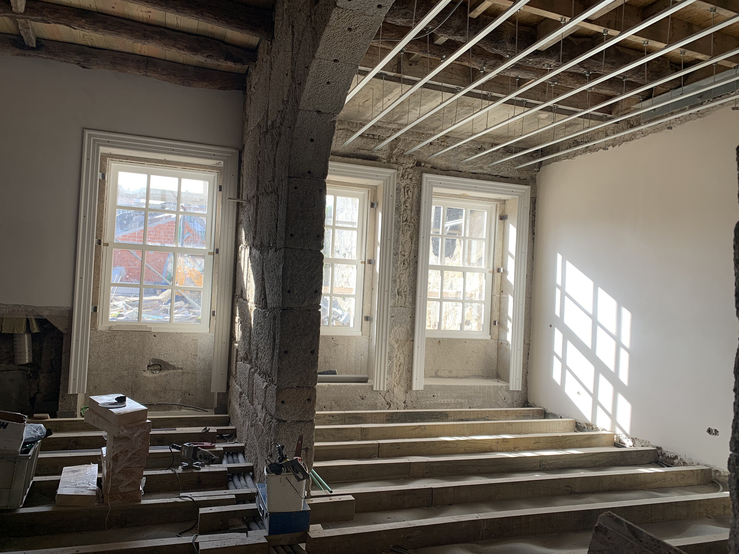 Looking west through apartment C. New windows and moldings