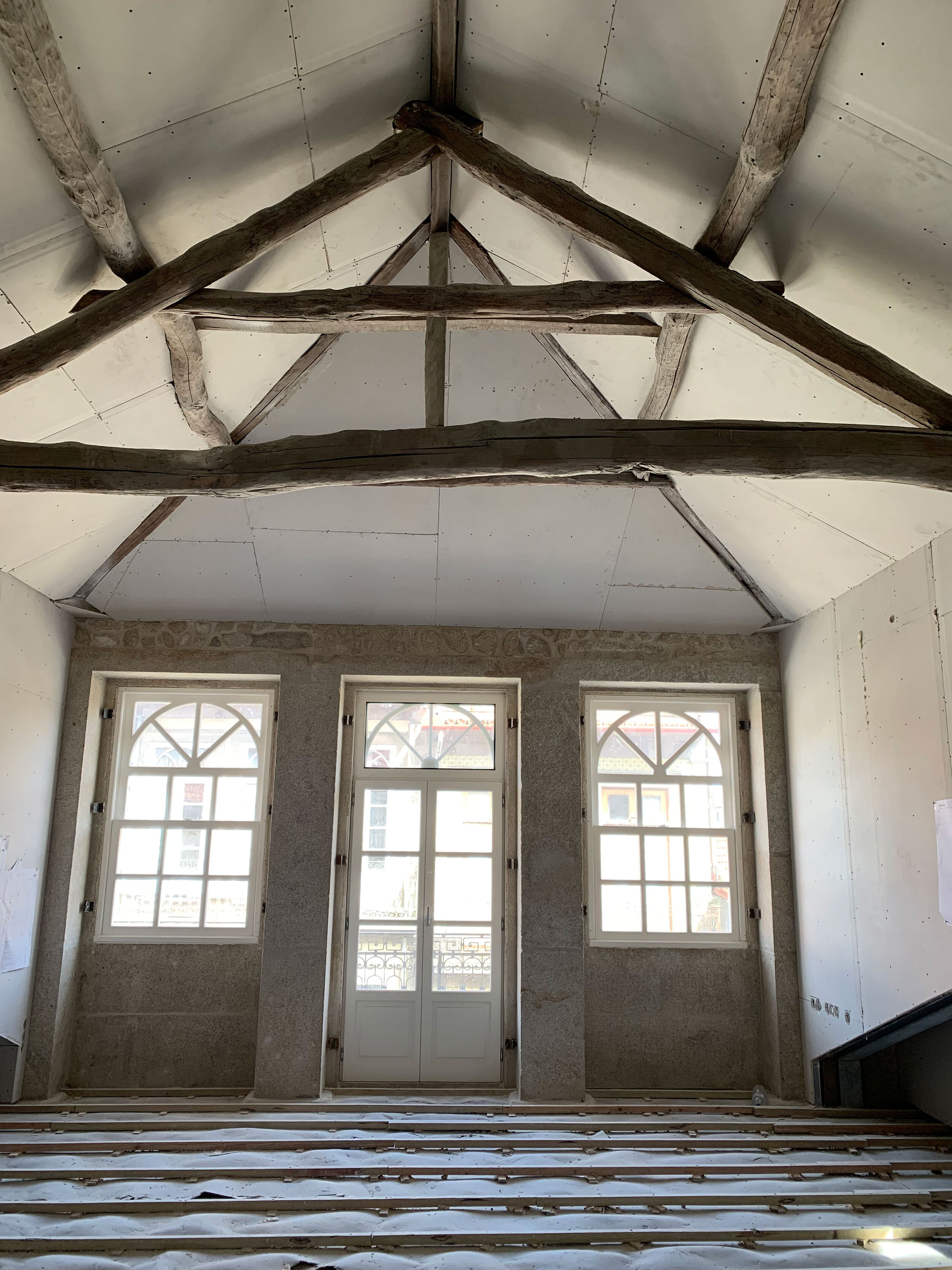 Sheetrock installation with exposed beams