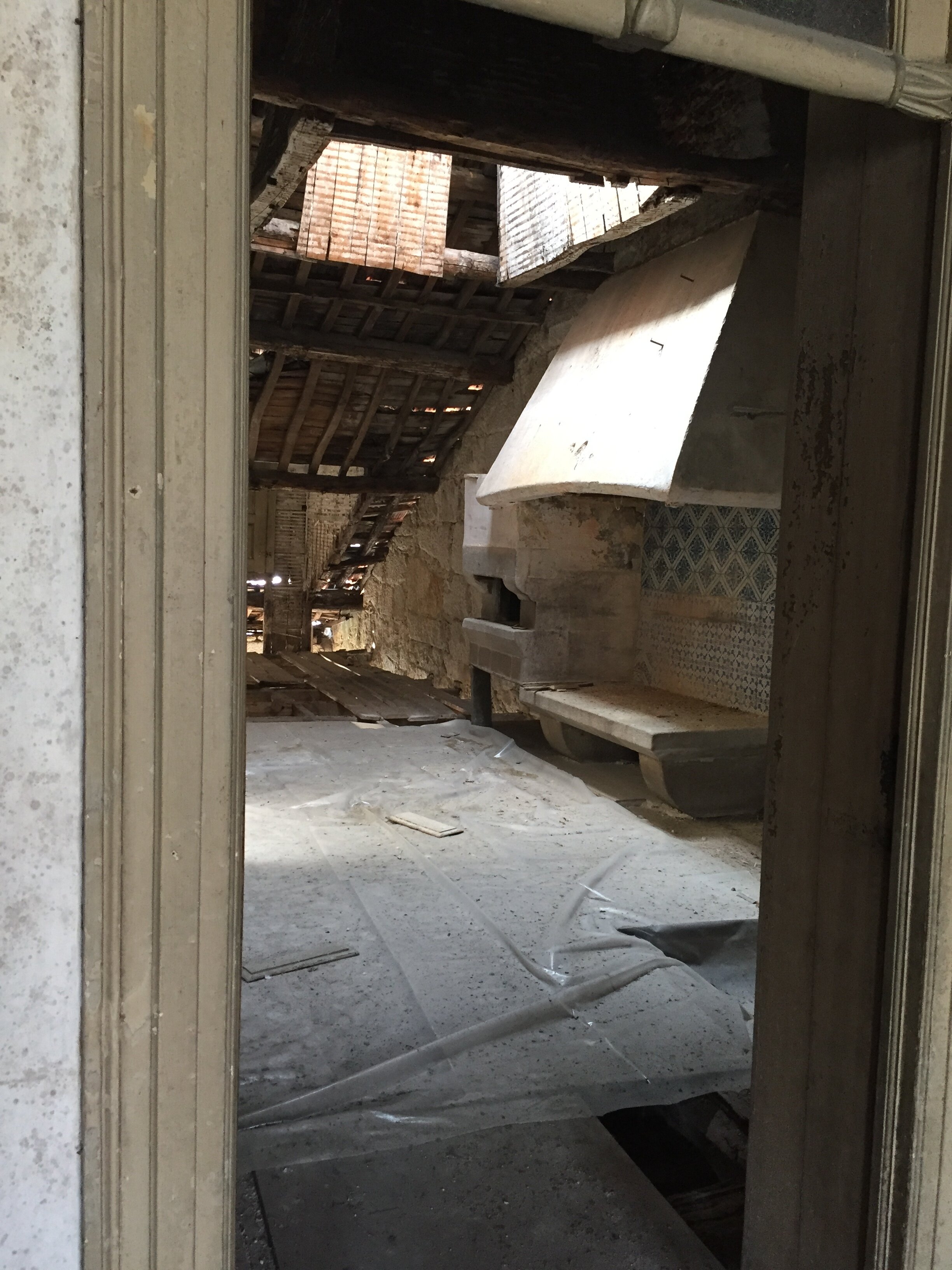 Interior of Apartment G with antique hearth and pre existing skylight