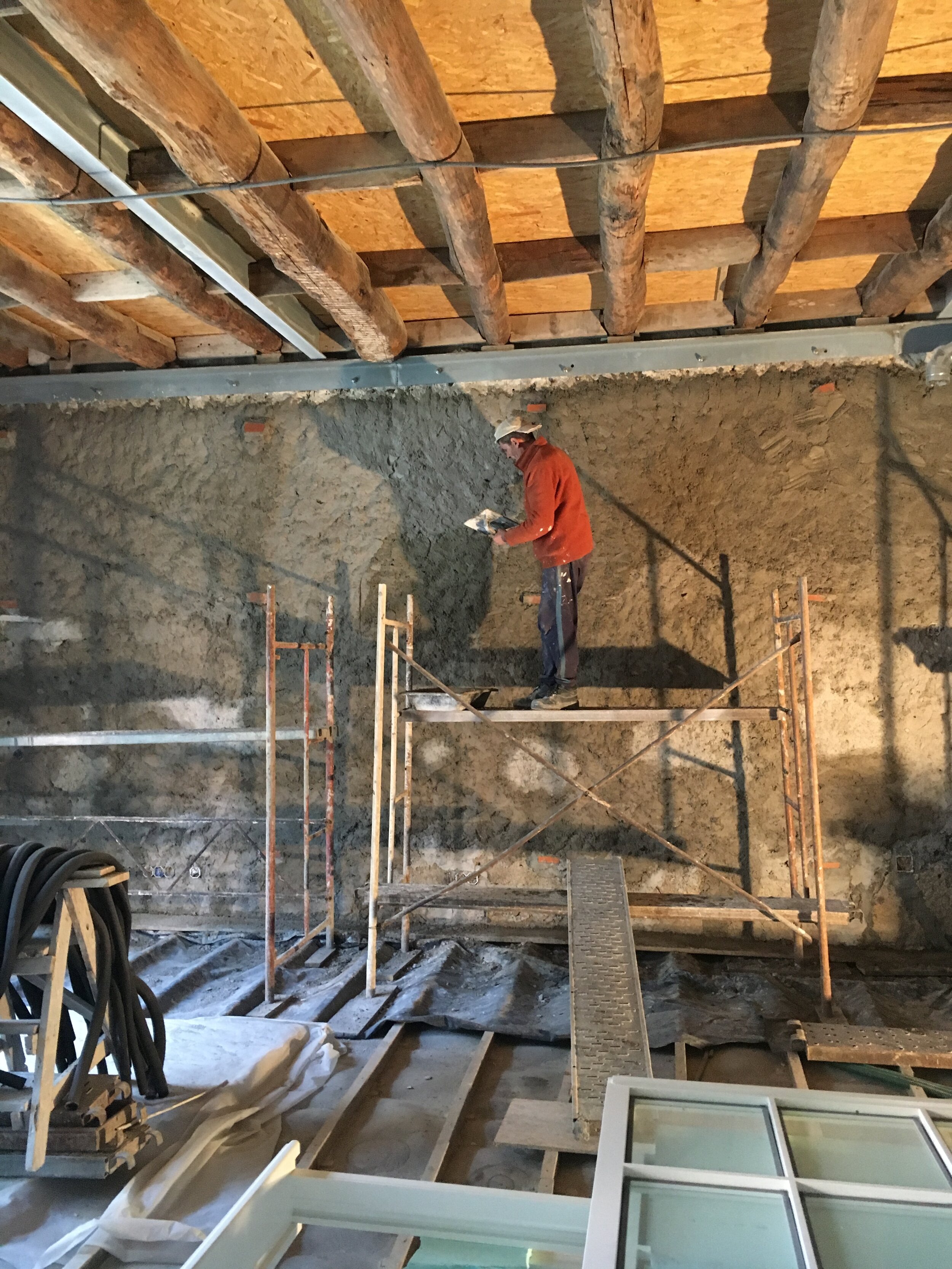 Preliminary plaster layer installation in Apartment D