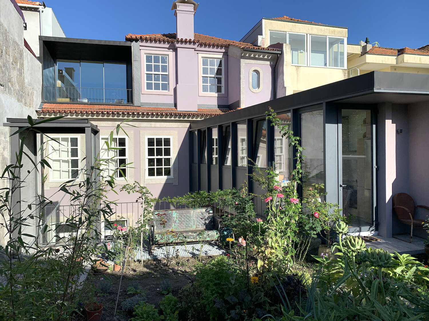  a view from the garden of the historic building and the attached kitchen of apartment C. 