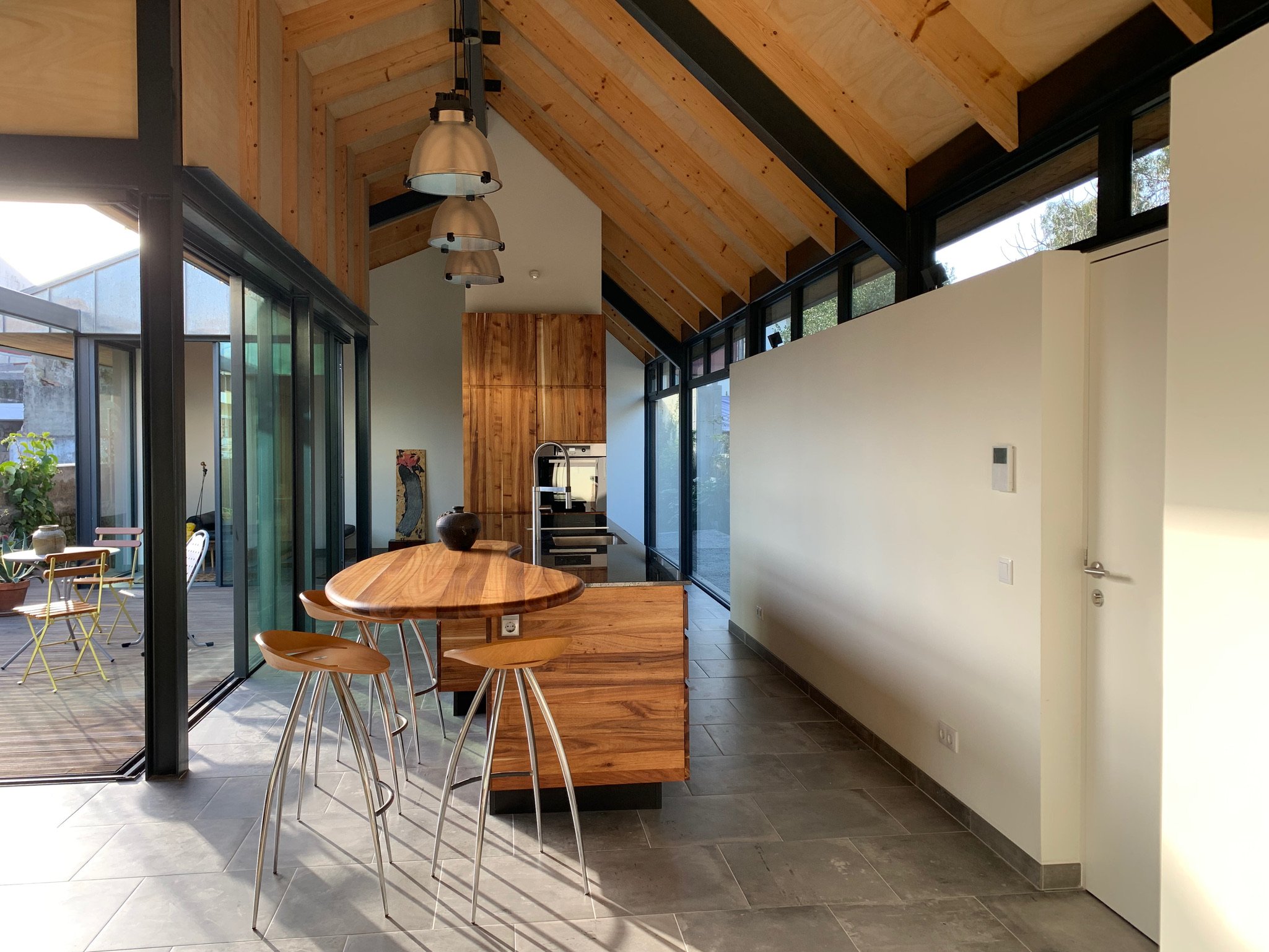 View from the master bedroom into the kitchen area and deck