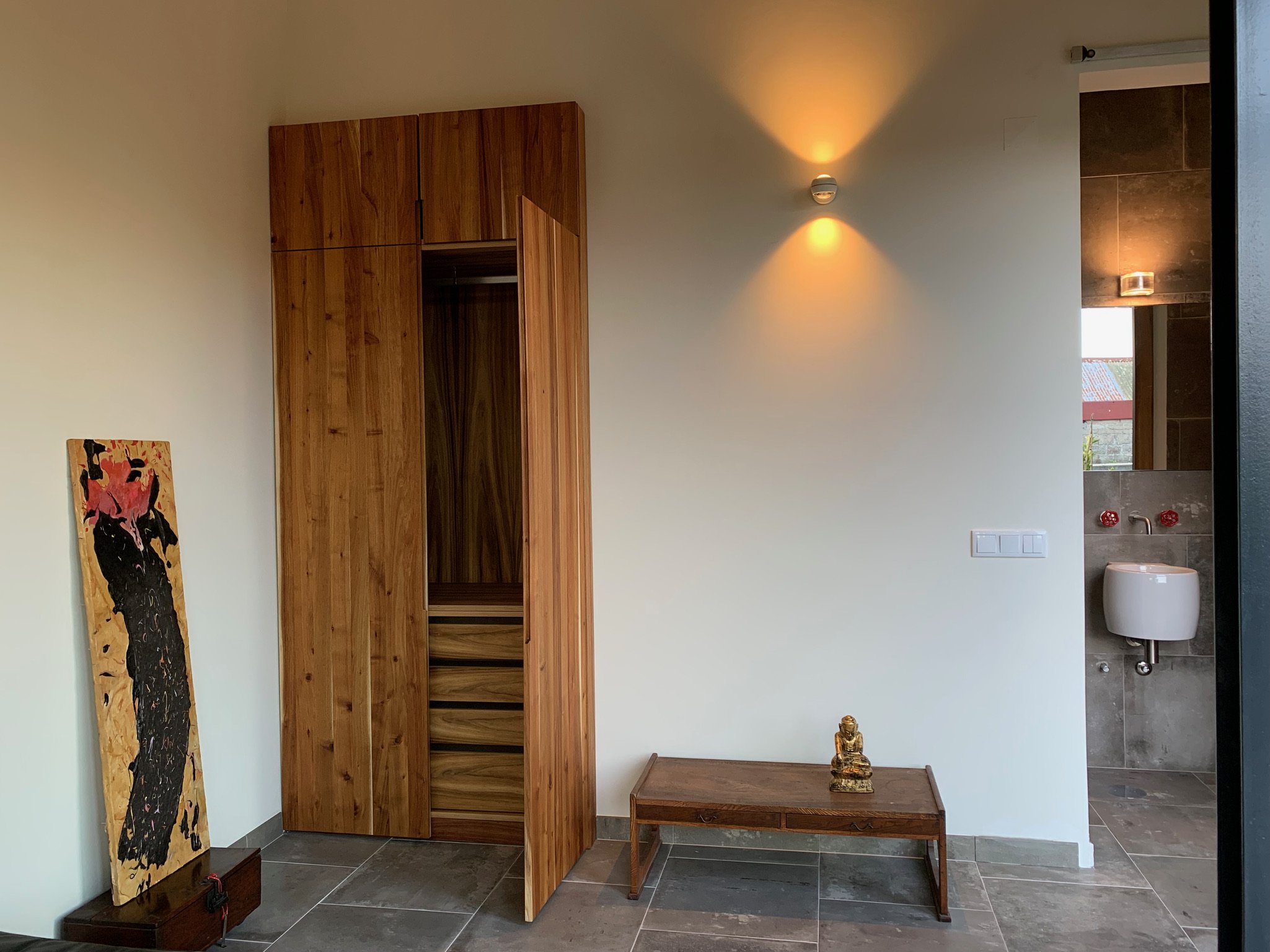 View of guest closet and bathroom