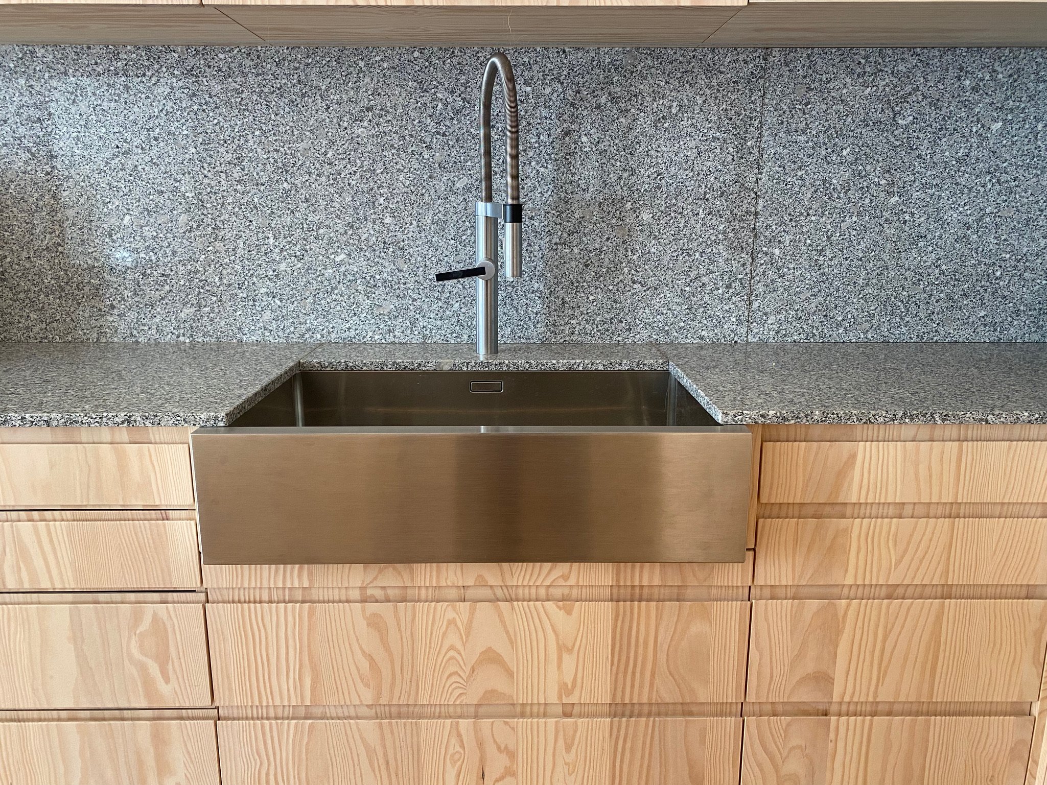 Granite counter tops and sink in apartment D