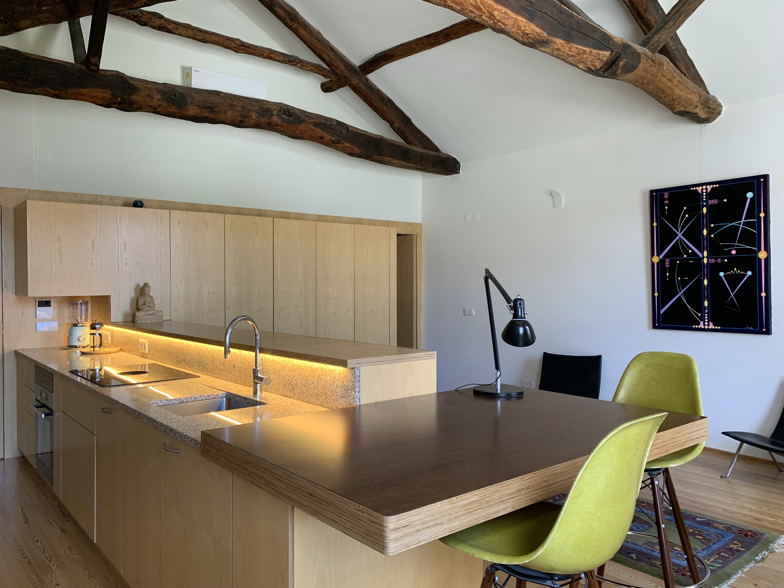 Kitchen area with attached dining table.