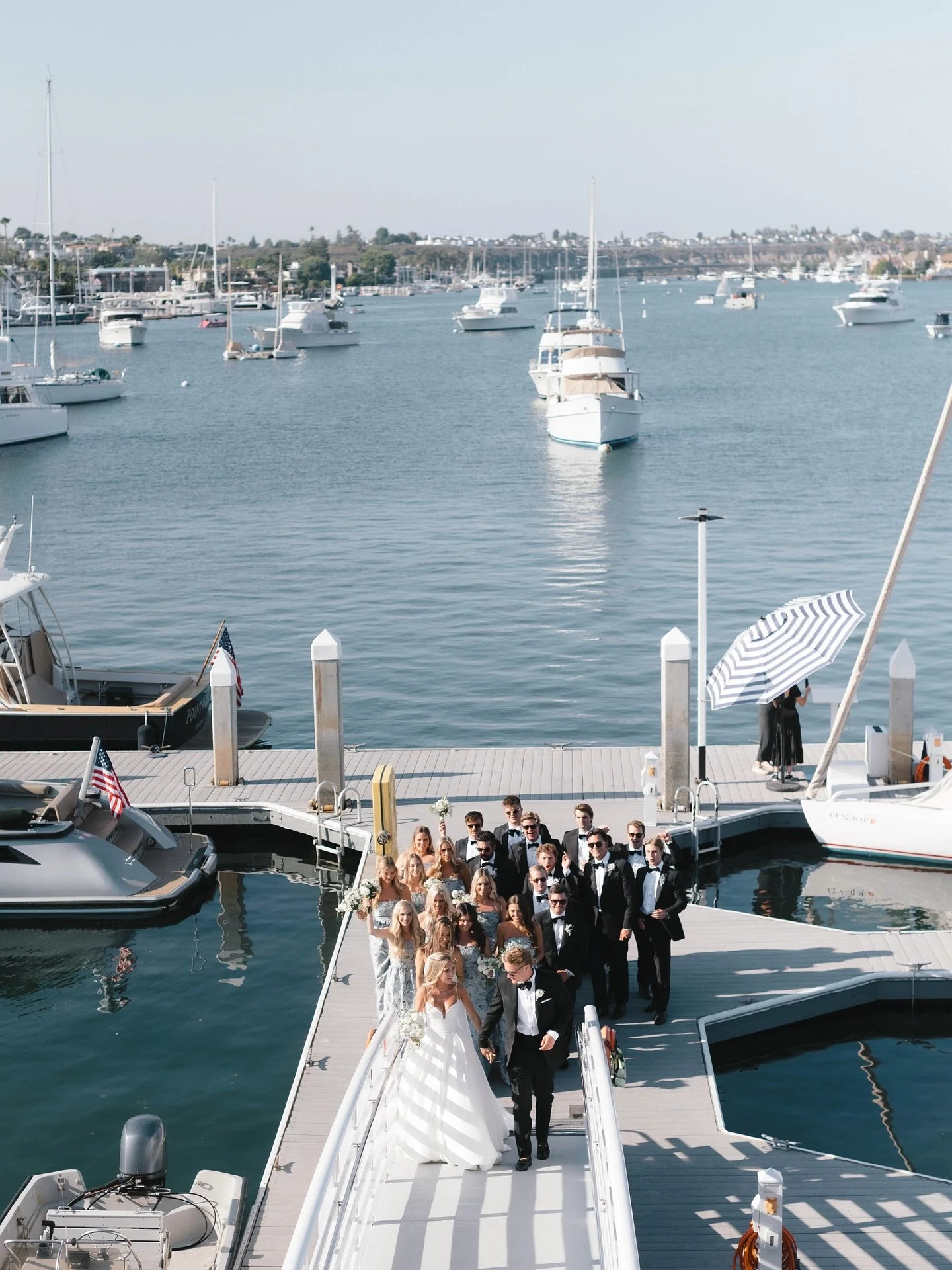 From the dock to the dance floor &mdash; an entrance worthy of Newport&rsquo;s golden hour ✨

Wedding Planner: @palmandpineevents
Venue: @newportharboryc
Photographer: @alyshamillerphotography
Videographer: @shoreandwave
Florist: @penelopepotsflorald