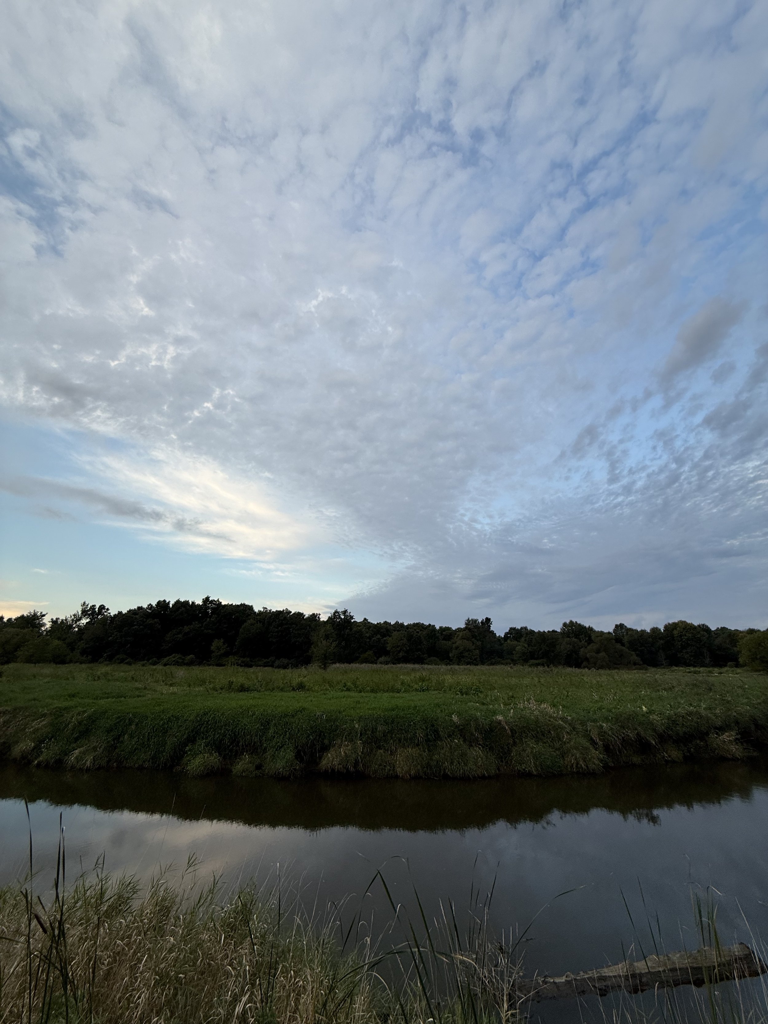 A dramtic sky over a creek on a September morning.