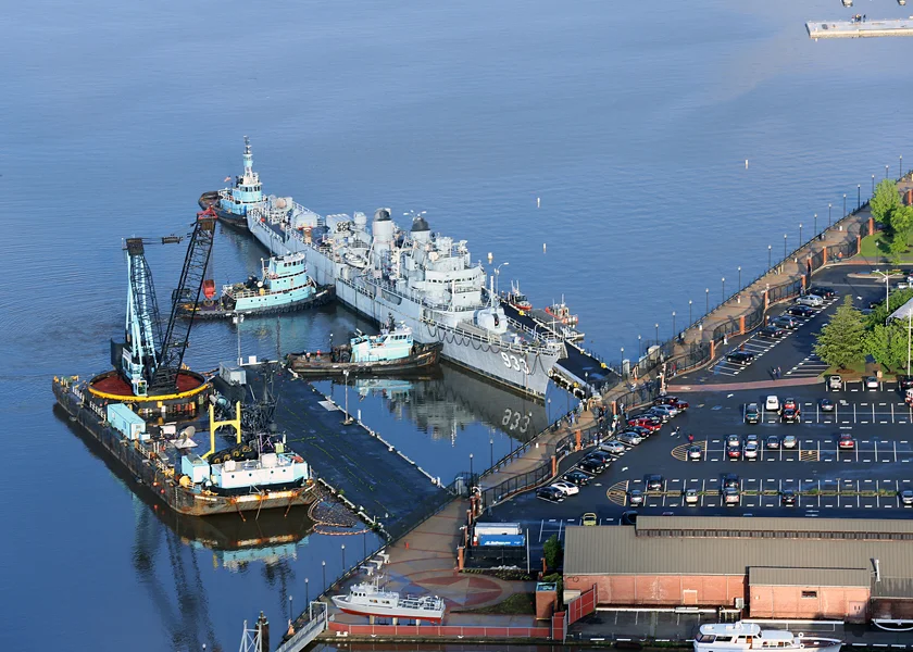 WASHINGTON, D.C. (May 7, 2016) – Tugboats prepare to tow Former USS Barry (DD 93) down the Anacostia River to Philadelphia for scrapping. Barry was a Display ship moored at the Washington Navy Yard since 1984. Named for Commodore John Barry, the ship was decommissioned in 1982. (U.S. Navy Photo by Scott Adam Webb/Released) 