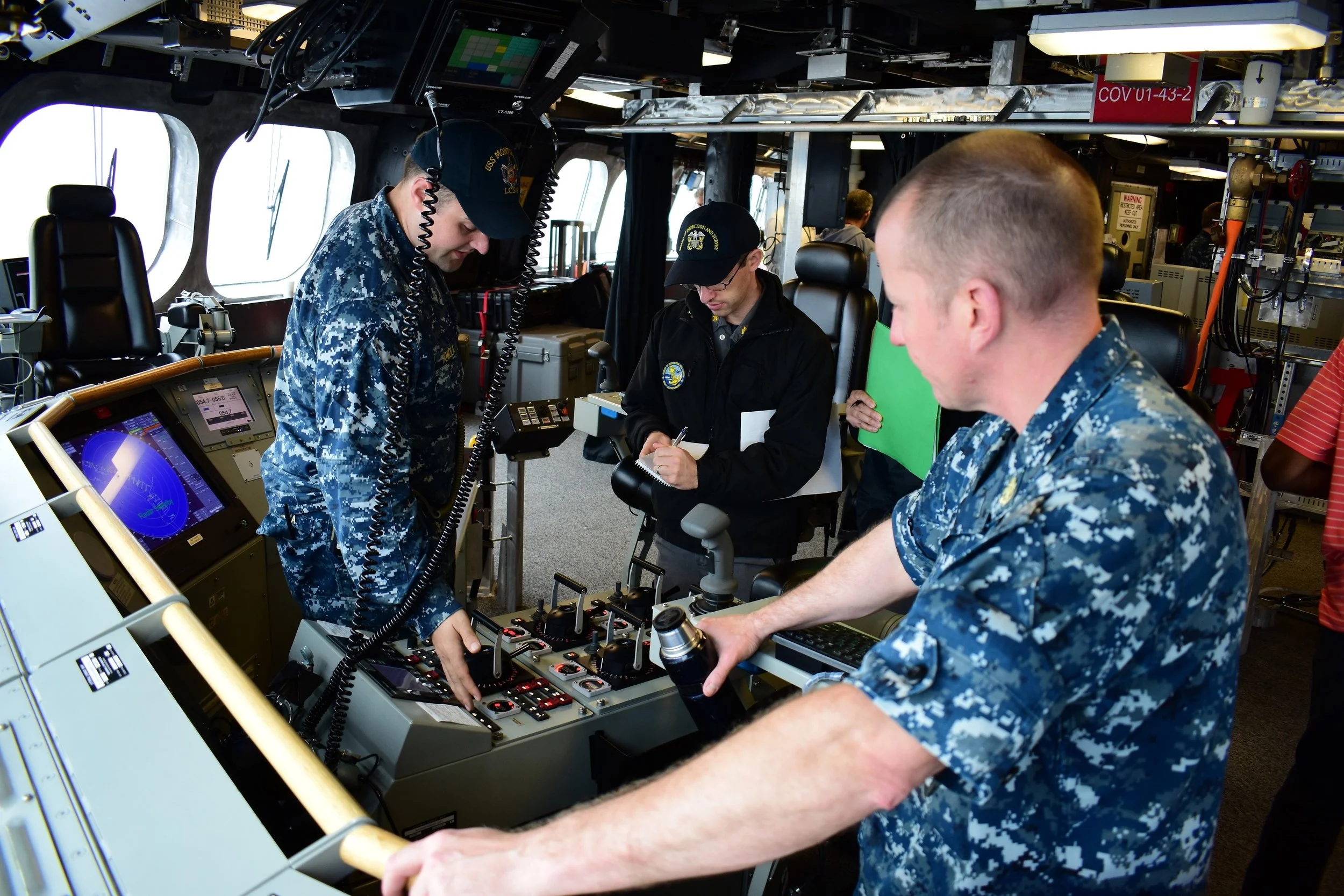 Naval engineering specialists aboard ship (U.S. Navy photo.)
