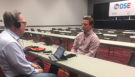 Vox Optima's Gary Potterfield talks digital signage strategies with Mason Page from Reflect Systems at the 2018 Digital Signage Expo in Las Vegas.