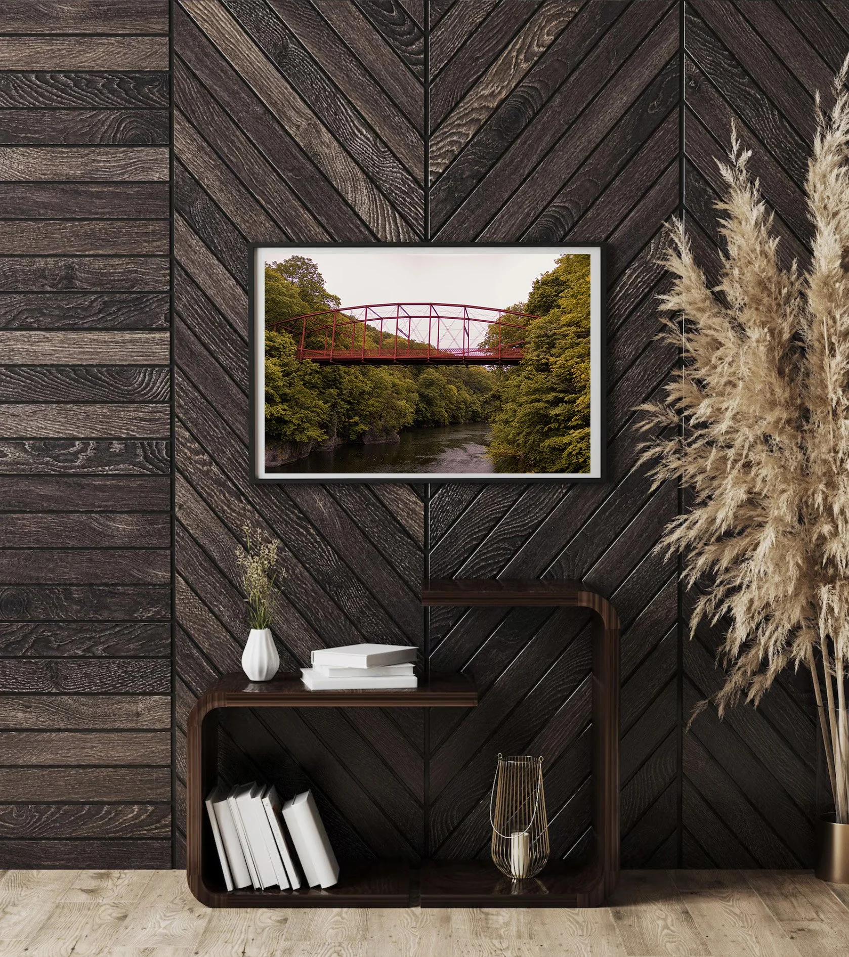 Historic red iron bridge at Lovers Leap State Park in Connecticut crossing above the Housatonic River with green trees and scenic forest landscape surrounding the gorge