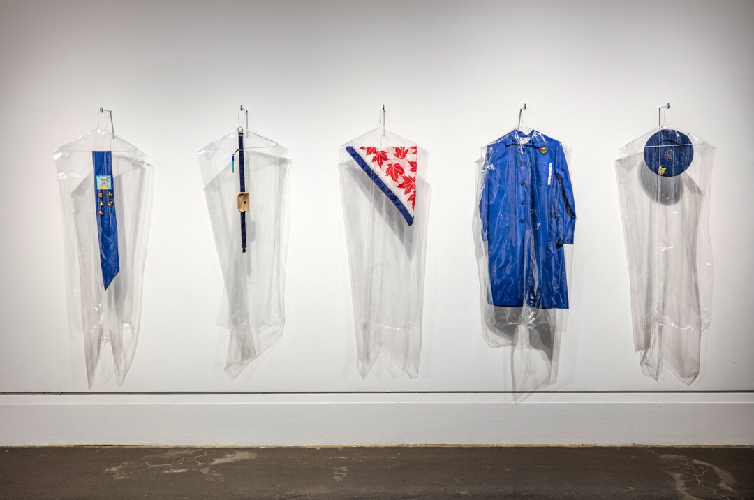   A Lot Can Change in 30 Years  (2016)  Girl Guide Uniform circa 1986 (belonging to the artist): dress, scarf, beret, sash, badges, belt, pouch, pencil, dry-cleaning bags, wire hangers. Variable dimensions 