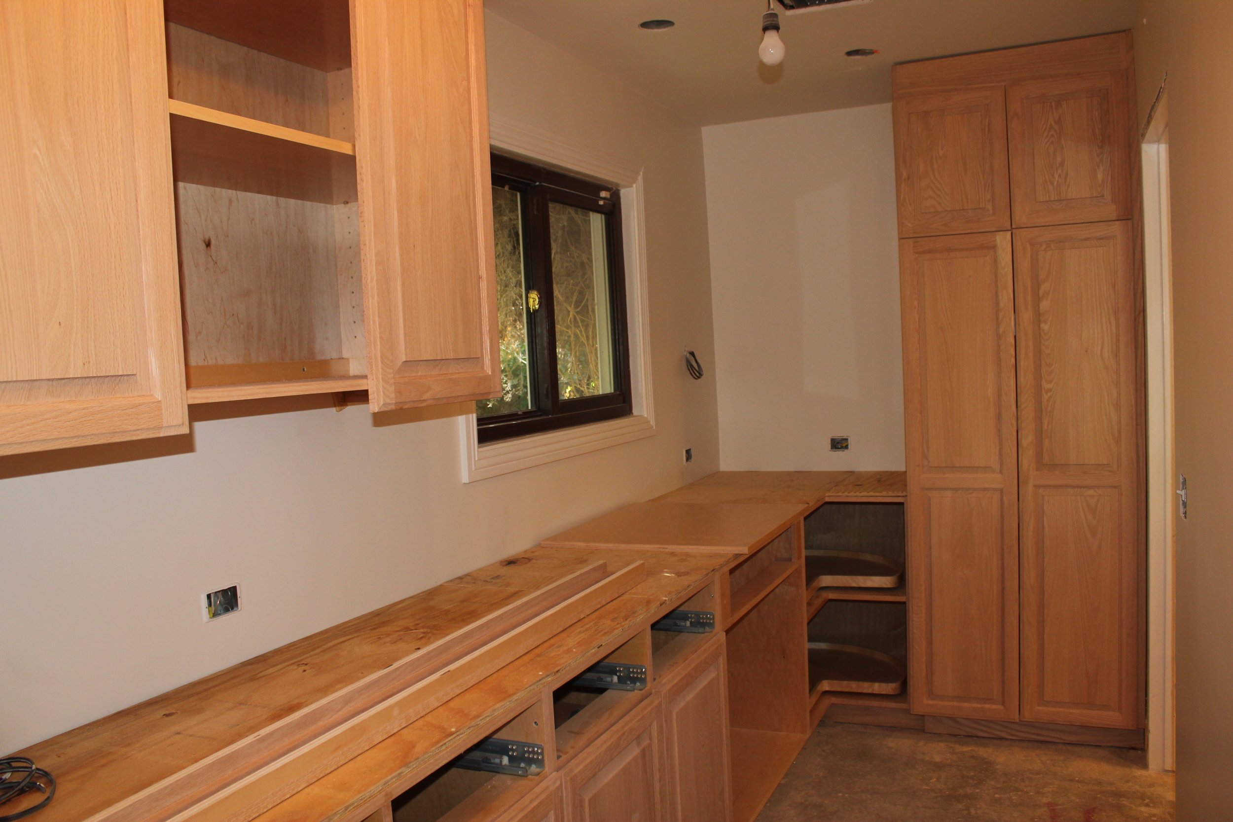Laundry Room and Butlers Pantry Cabinets before staining and counters.