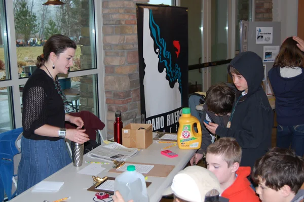 IRU Board Member Jessica Holmes helps teach Boise-area kids about river and water issues. (Photo by Jeff Cole)