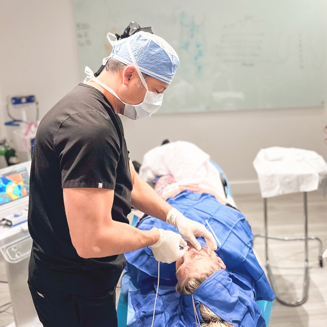 Jack Zamora, MD  performing ATTIVA treatment on patient's face