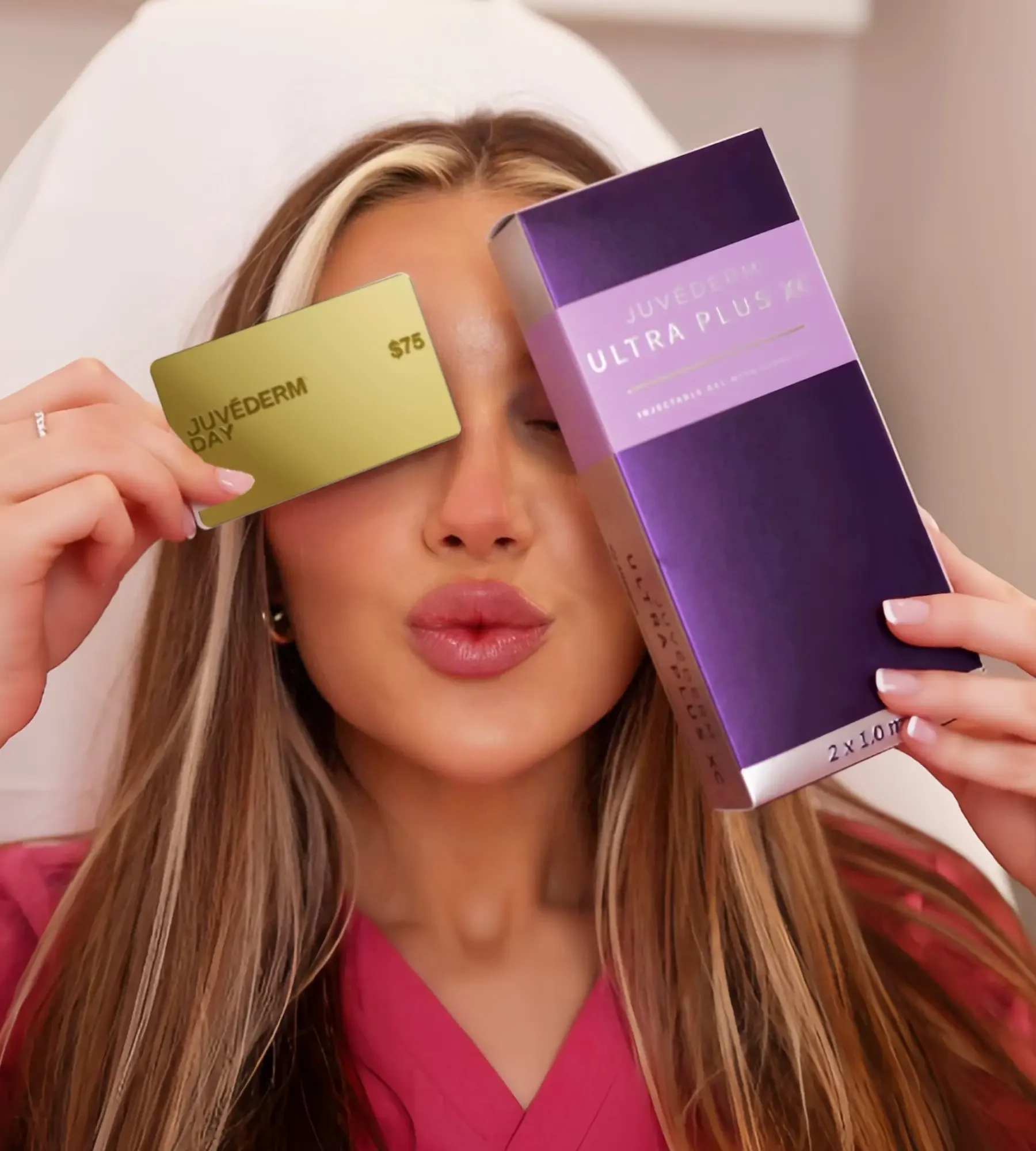Woman with Juvederm gift card and filler product
