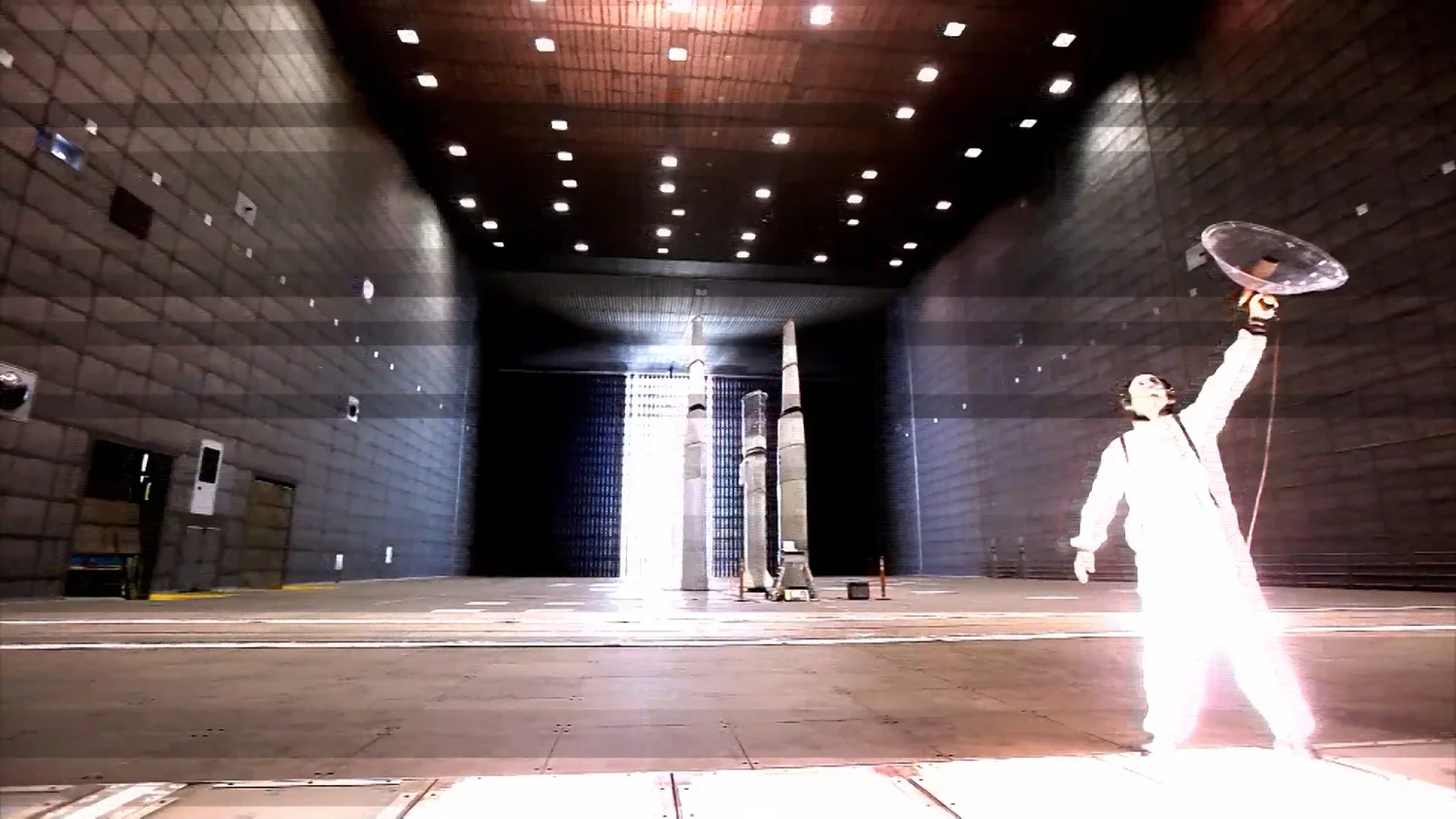 Charles Lindsay in a white suit in the NASA Ames chamber, NEAR(ER)