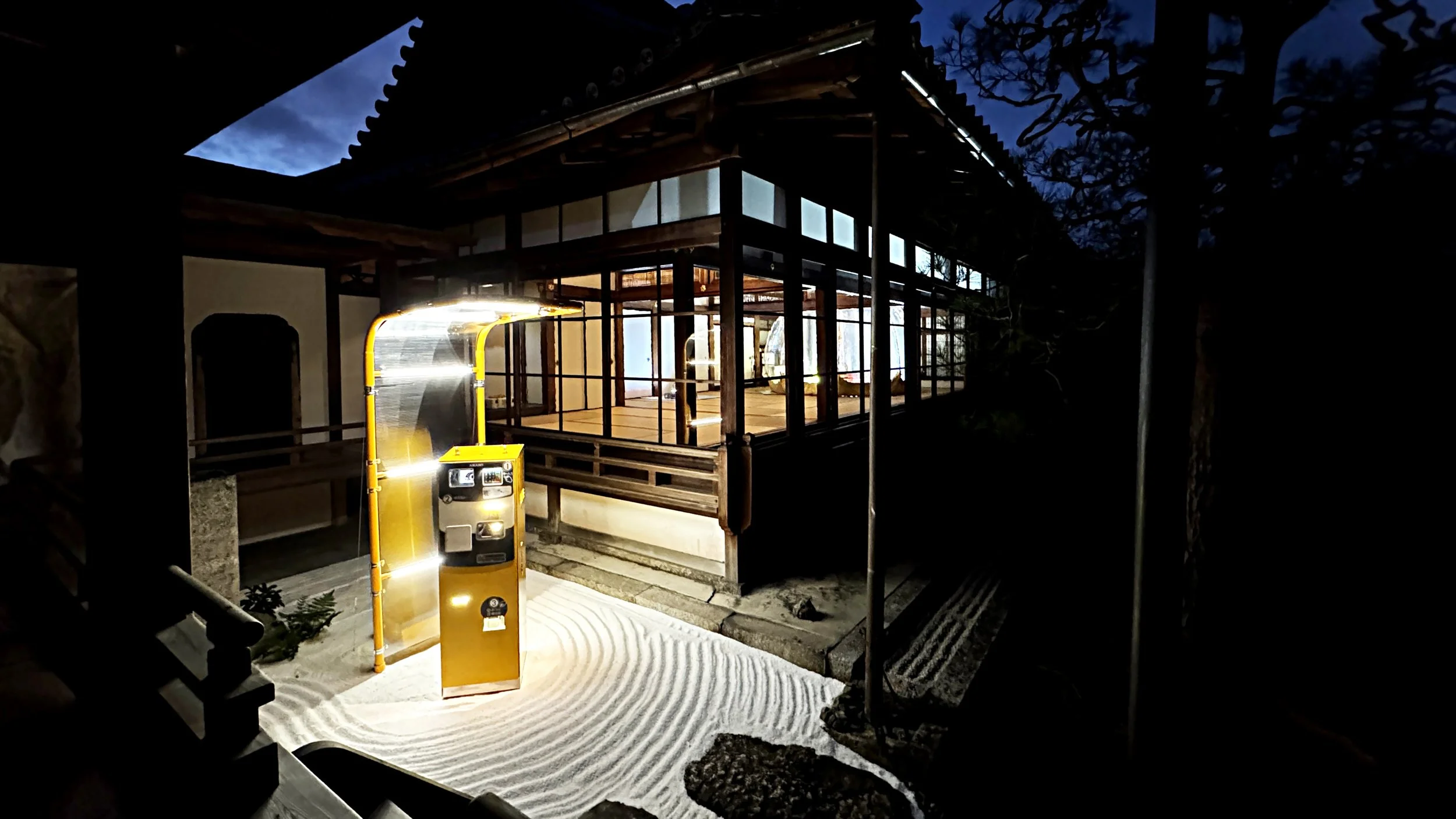 Yellow Amano parking meter in the Zen garden at Ryosokuin, Kyoto, from PLEASE FORGET (EVERYTHING).