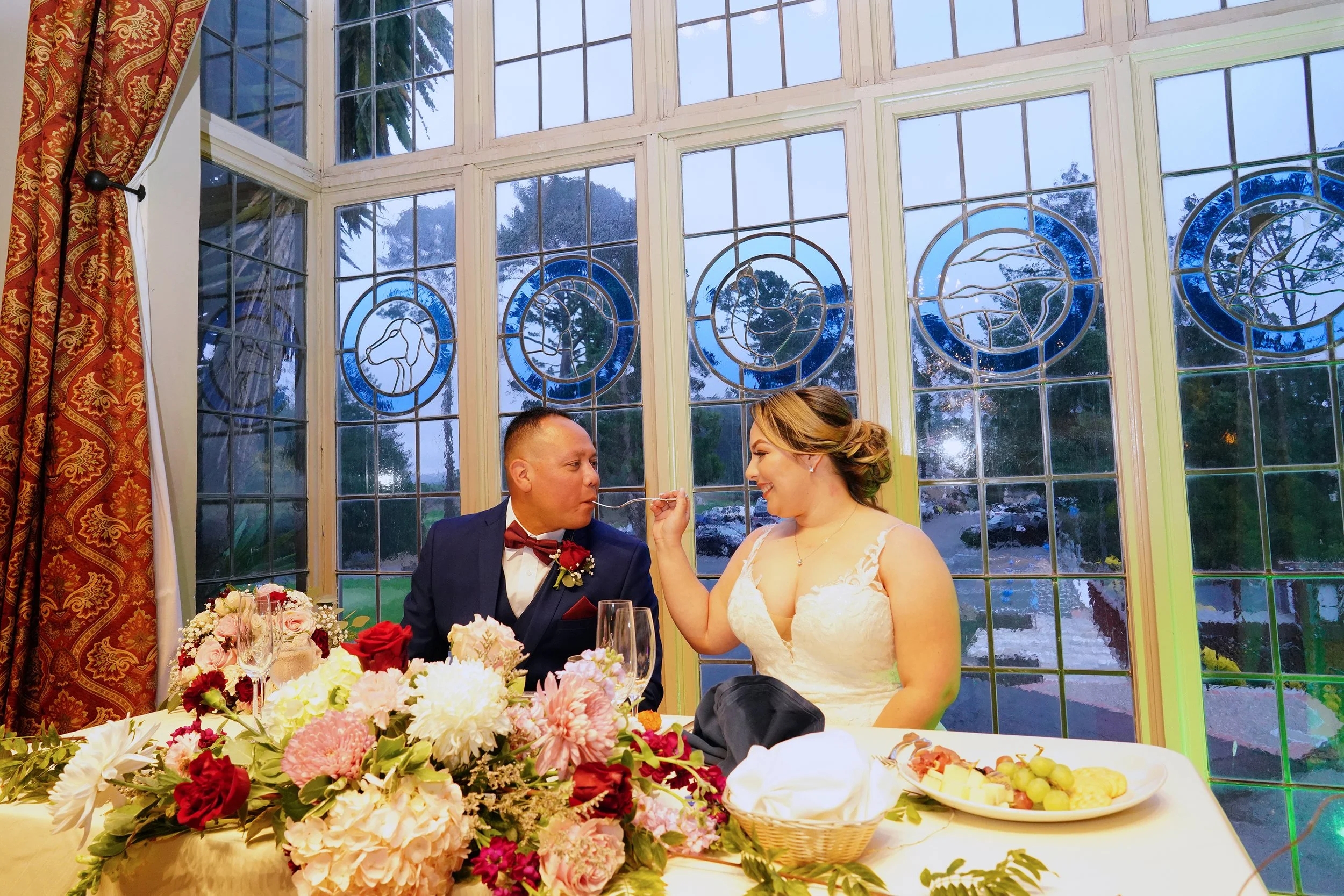luxury-bride-feeding-groom-cake-reception-berkeley-country-club.jpg