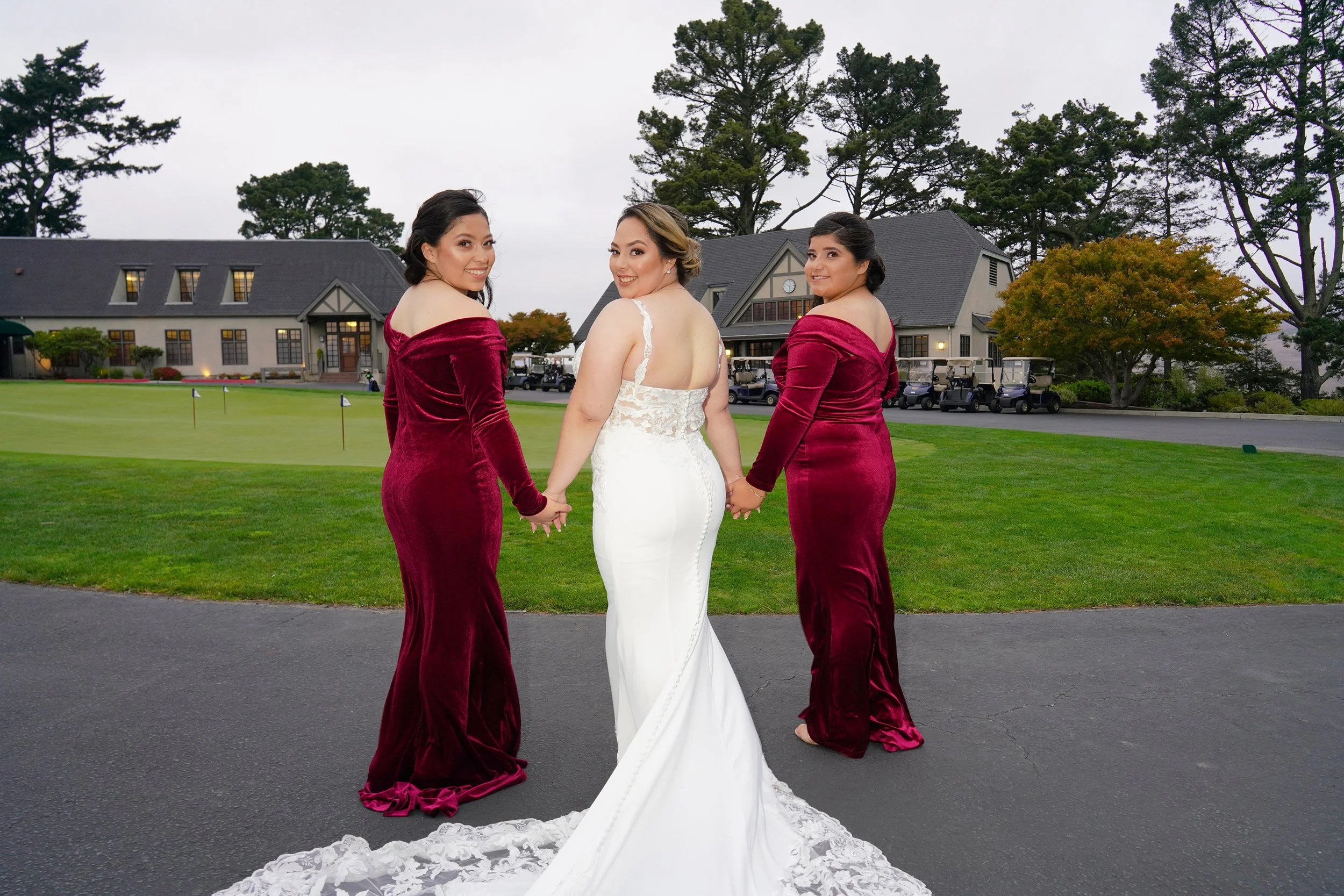 luxury-bridesmaids-looking-over-shoulder-wedding-group-photo-berkeley-country-club.jpg