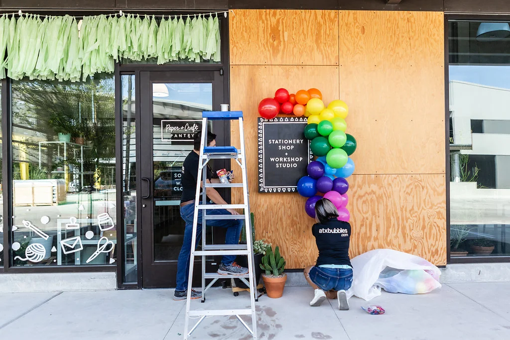 The Paper + Craft Pantry balloon garland install by ATX BUBBLES for Official Re-Opening Weekend.