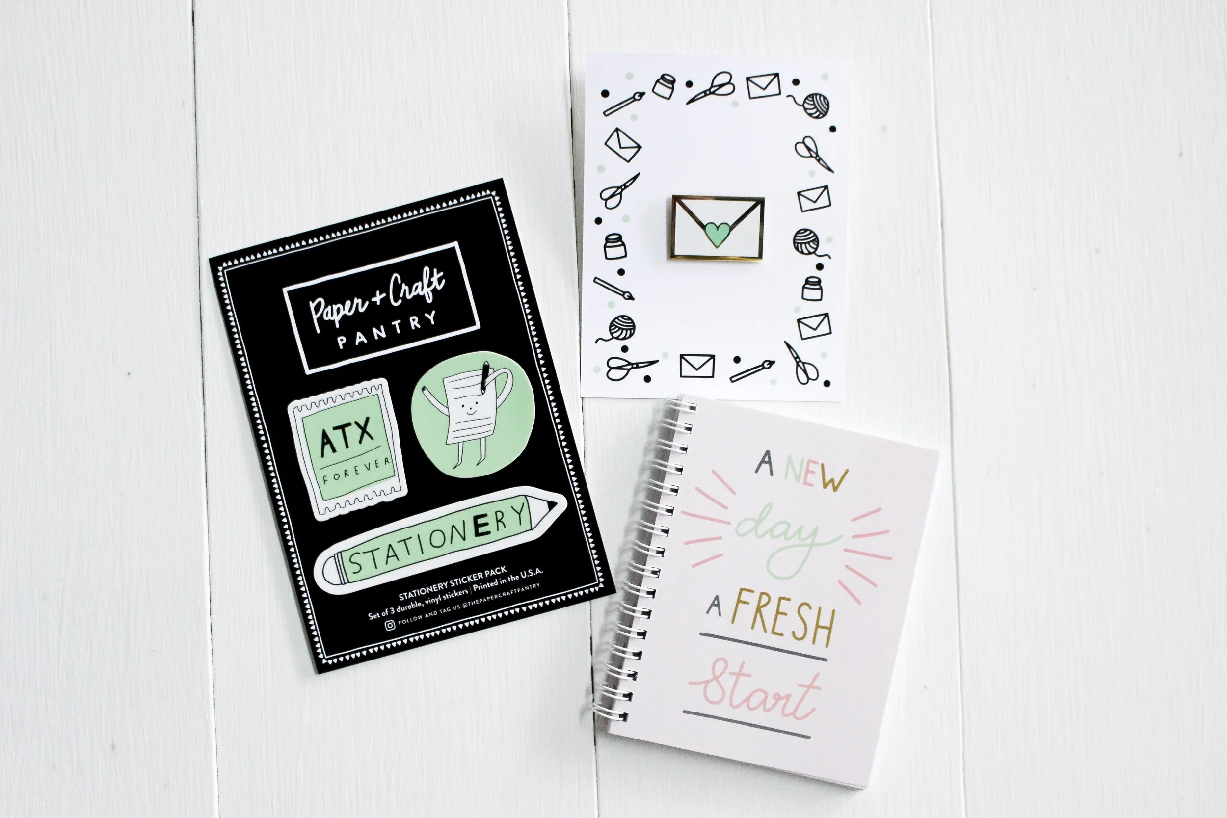 The Paper + Craft Pantry: Our sticker set, daily mini journal, and envelope enamel pin.