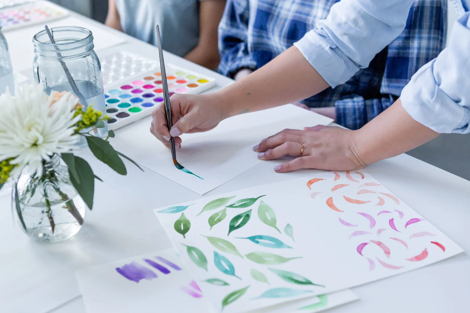 The Paper + Craft Pantry Blog: Watercolor floral workshop instructor helping to show different stroke techniques.