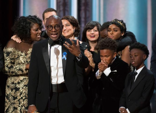 Director Barry Jenkins, producers, and cast members of Moonlight on stage to receive Best Picture award. 