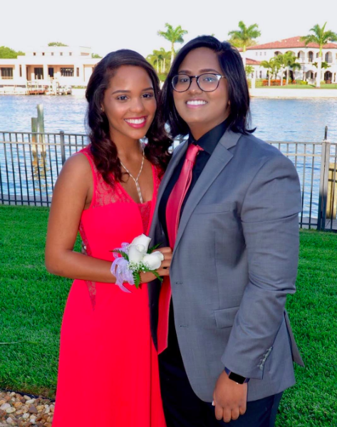  Paula and Anjali pose for a picture before attending Anjali's prom. 
