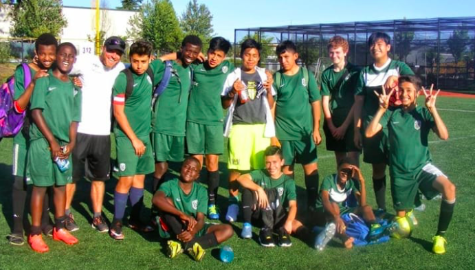 Coach Kaig (white shirt) with some of his youth team players.